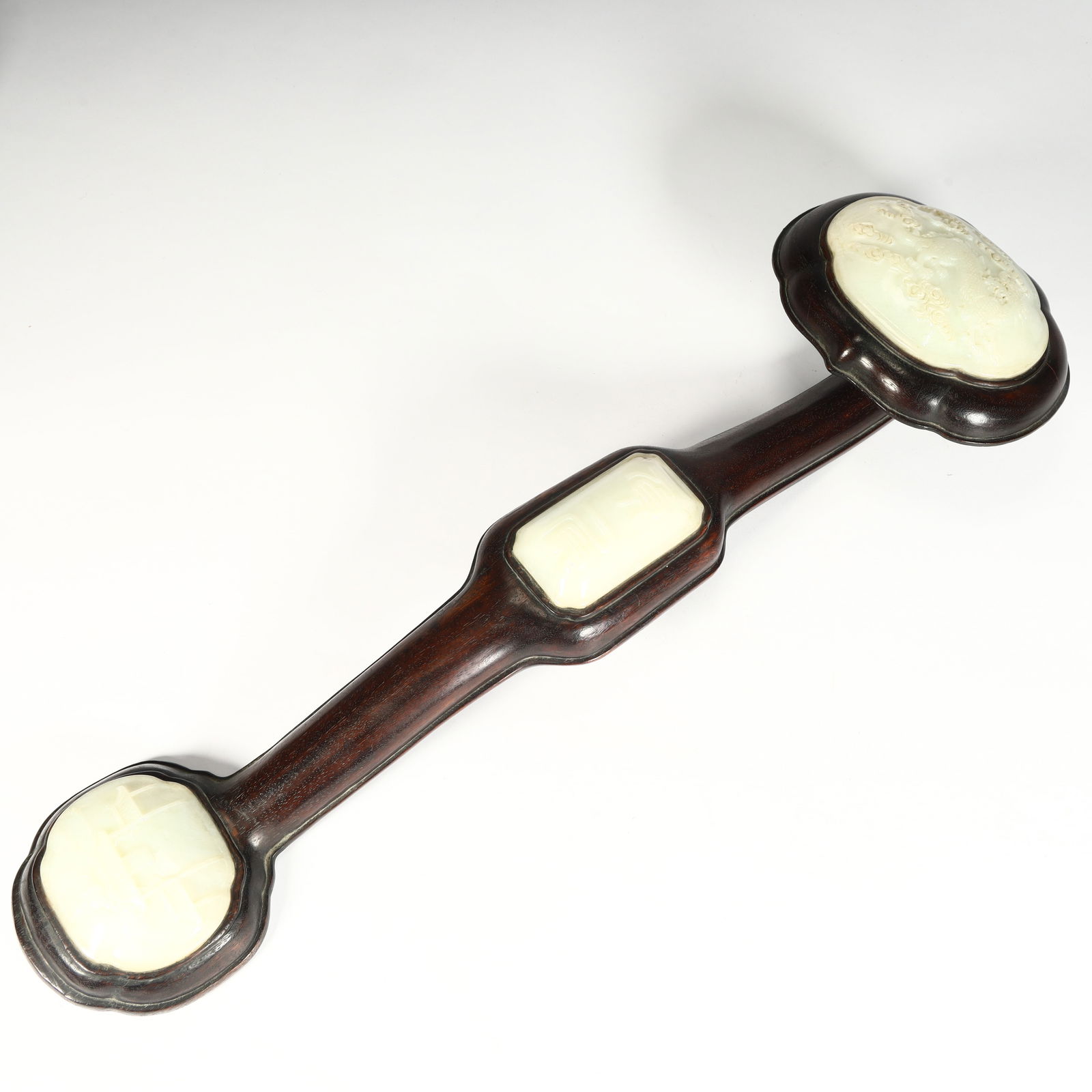 A Qing Dynasty rosewood inlaid jade ruyi (1 of 12)