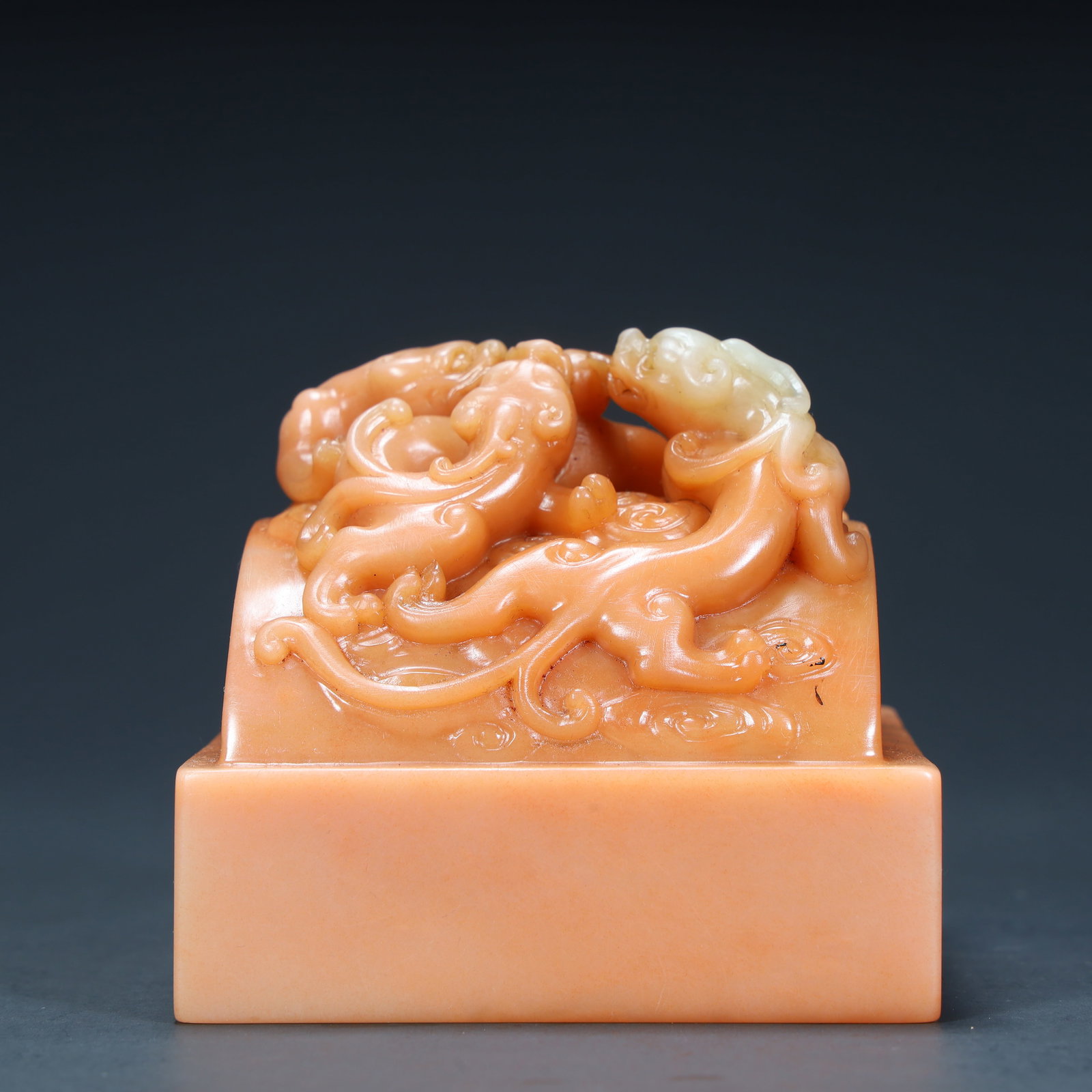 A Qing Dynasty Shoushan stone group dragon button seal (1 of 11)