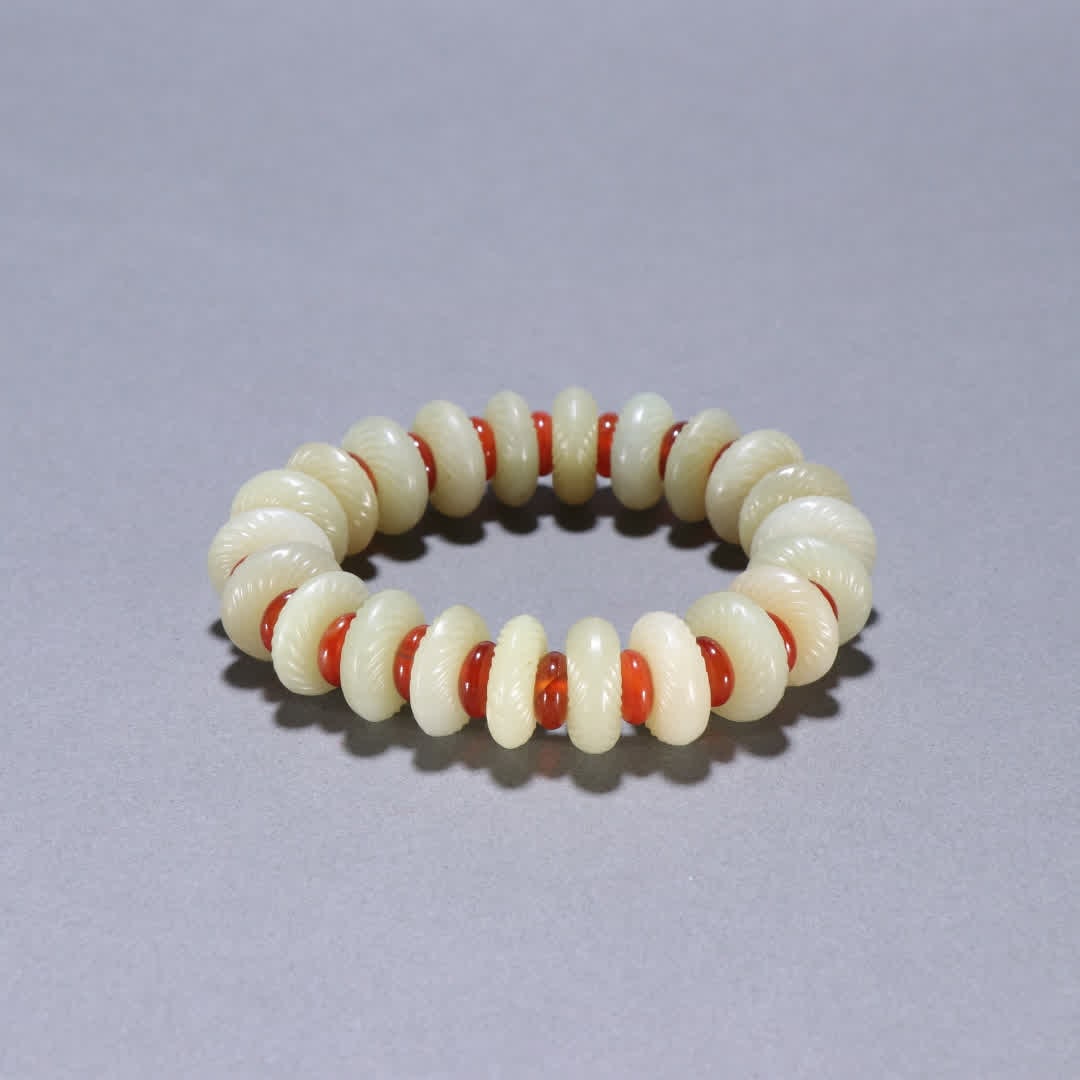 A Qing Dynasty Hetian jade carved spiral pattern bracelet (1 of 9)