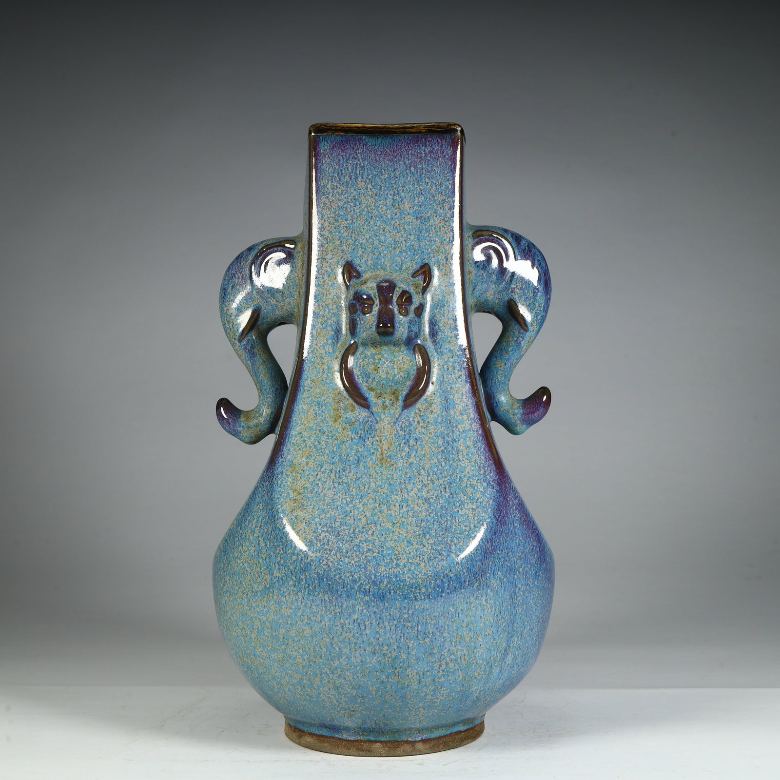 A Qing Dynasty Qianlong kiln glazed elephant ear square bottle (1 of 12)