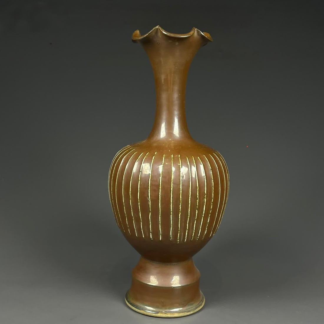 A Song Dynasty sauce-glazed long-necked bottle (1 of 9)