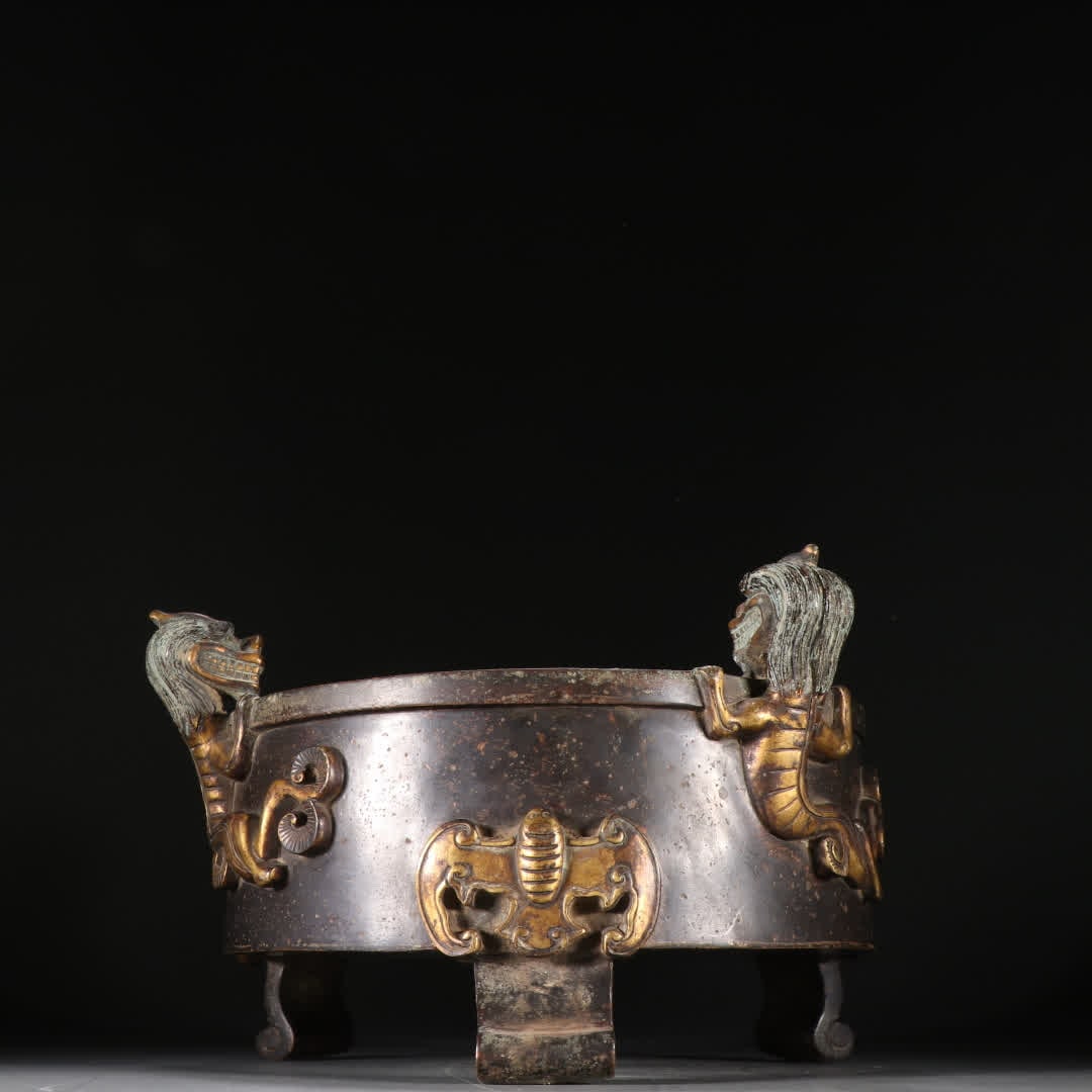 A copper-gilt dragon pattern three-legged incense burner (1 of 9)