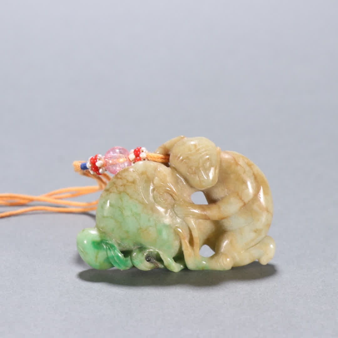 A Qing Dynasty jade monkey birthday pendant (1 of 9)