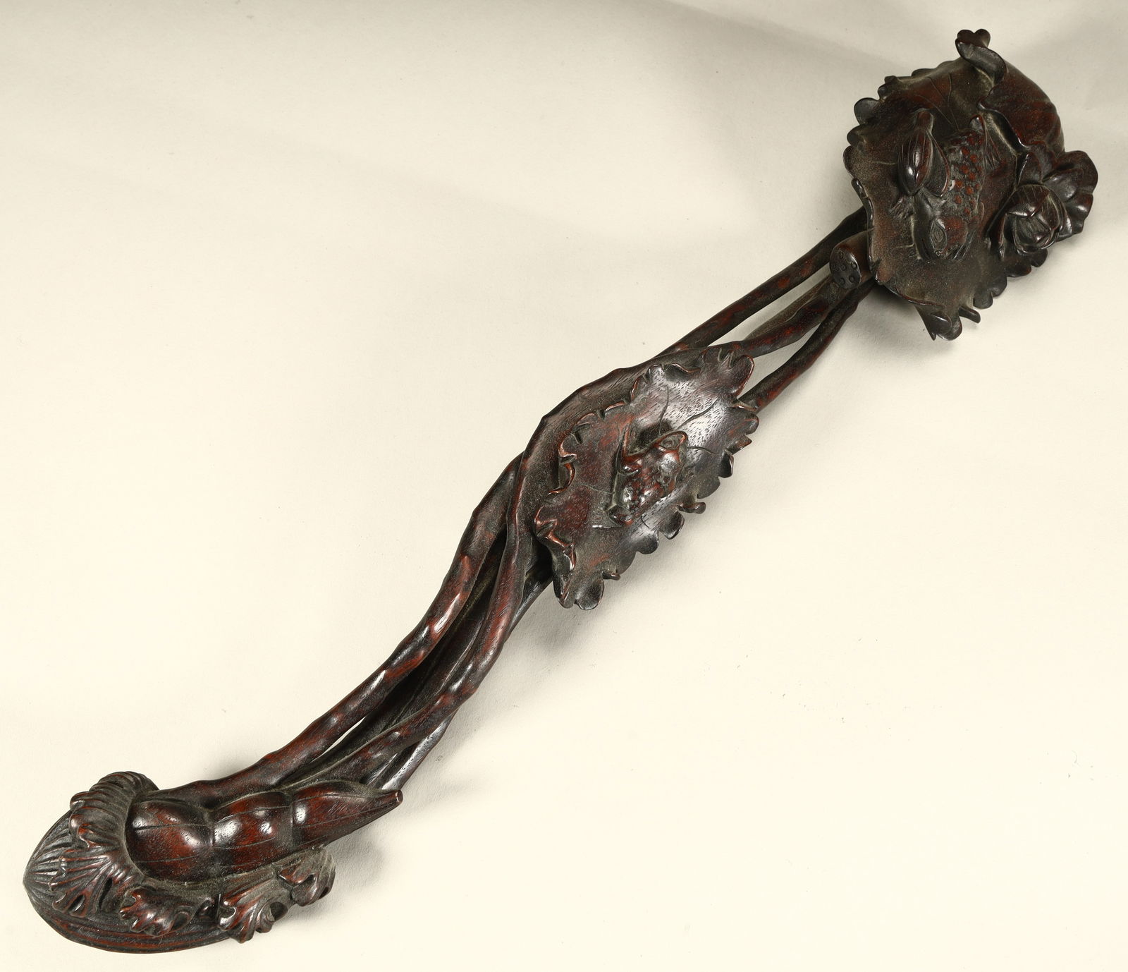 A Qing Dynasty rosewood carved lotus with a noble child pattern (1 of 12)