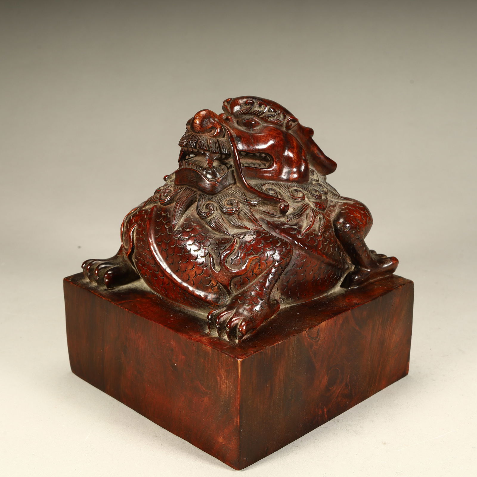 A Qing Dynasty Huanghuali wood carving auspicious beast seal (1 of 8)