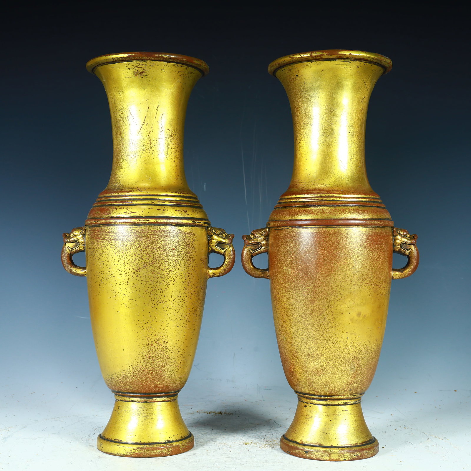 A pair of copper-gilt vases from the Qing Dynasty (1 of 9)