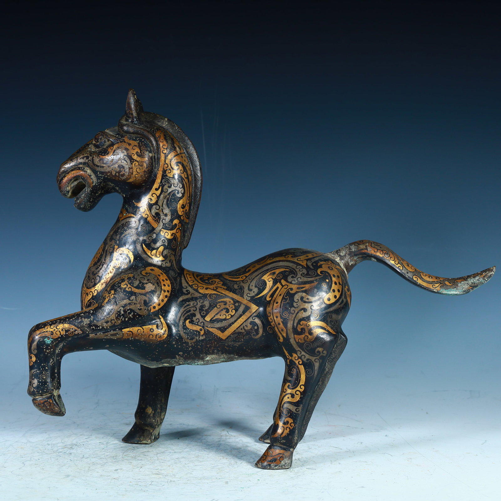 A Han Dynasty copper wrong gold and silver horse ornament (1 of 9)