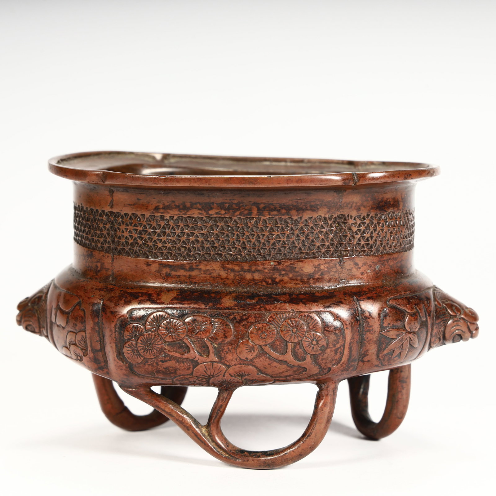 A Qing Dynasty copper-carved pine and bamboo pattern animal ear three-legged incense burner (1 of 11)