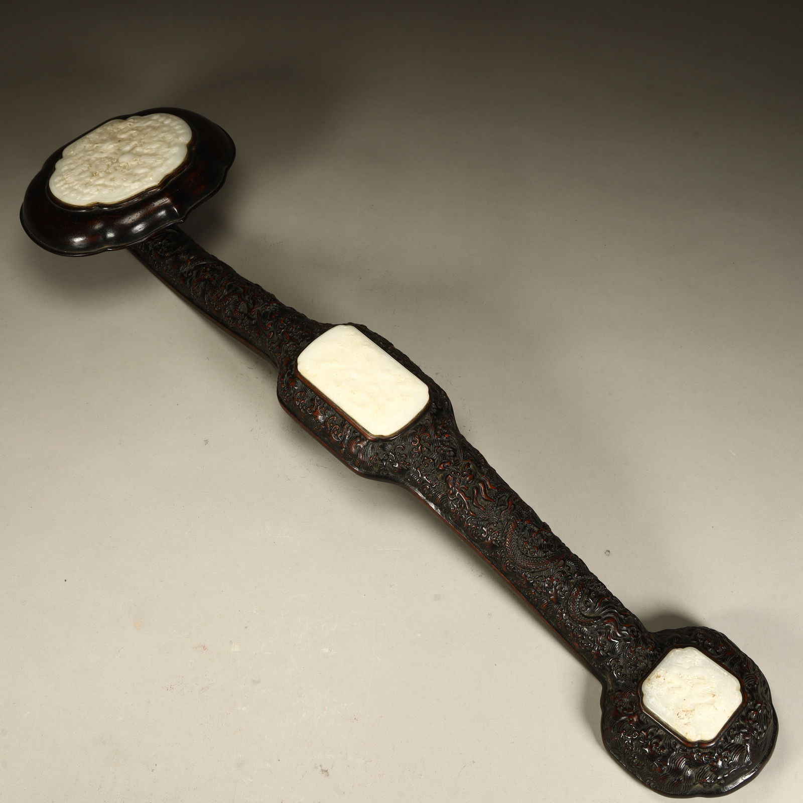 A Qing Dynasty rosewood inlaid jade triple ruyi (1 of 11)