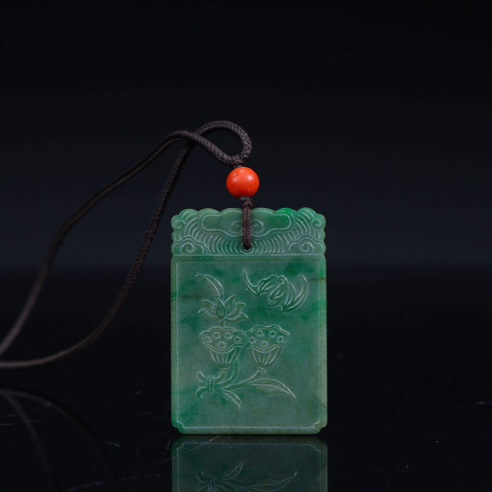 A Qing Dynasty jade lotus pattern pendant (1 of 10)