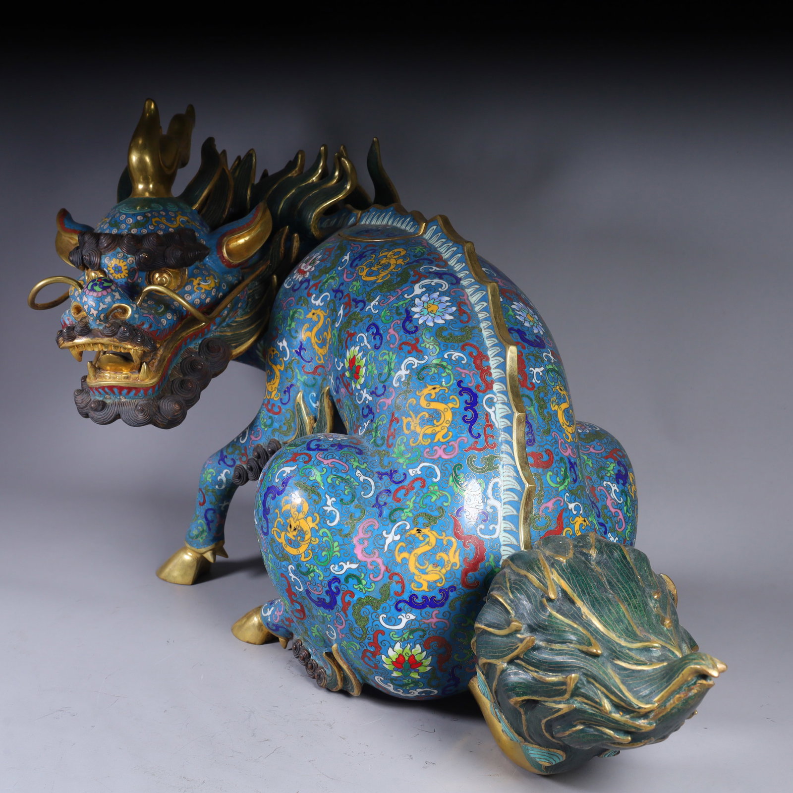 A Qing Dynasty copper gilt cloisonné enamel unicorn beast: Qing Dynasty copper gilt cloisonné enamel unicorn beast SIZE: H:39cm L:65cm W:30cm W:23.4kg (The Dimensions Of All Batches Are Manually Measured.If You Need More Detailed Information, Please Contact