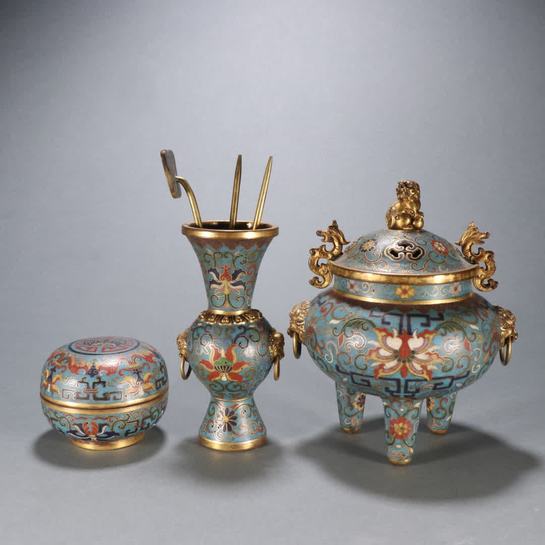 A set of Qing Dynasty copper gilt cloisonné entwined lotus pattern furnace bottle box: Qing Dynasty copper gilt cloisonné entwined lotus pattern stove bottle box set SIZE: Bottle H:12.5cm W:5.4cm W:313g Furnace H:16cm W:13cm W:660.4g Box H:5.8cm W:7.4cm W:330g (The Dimensions Of