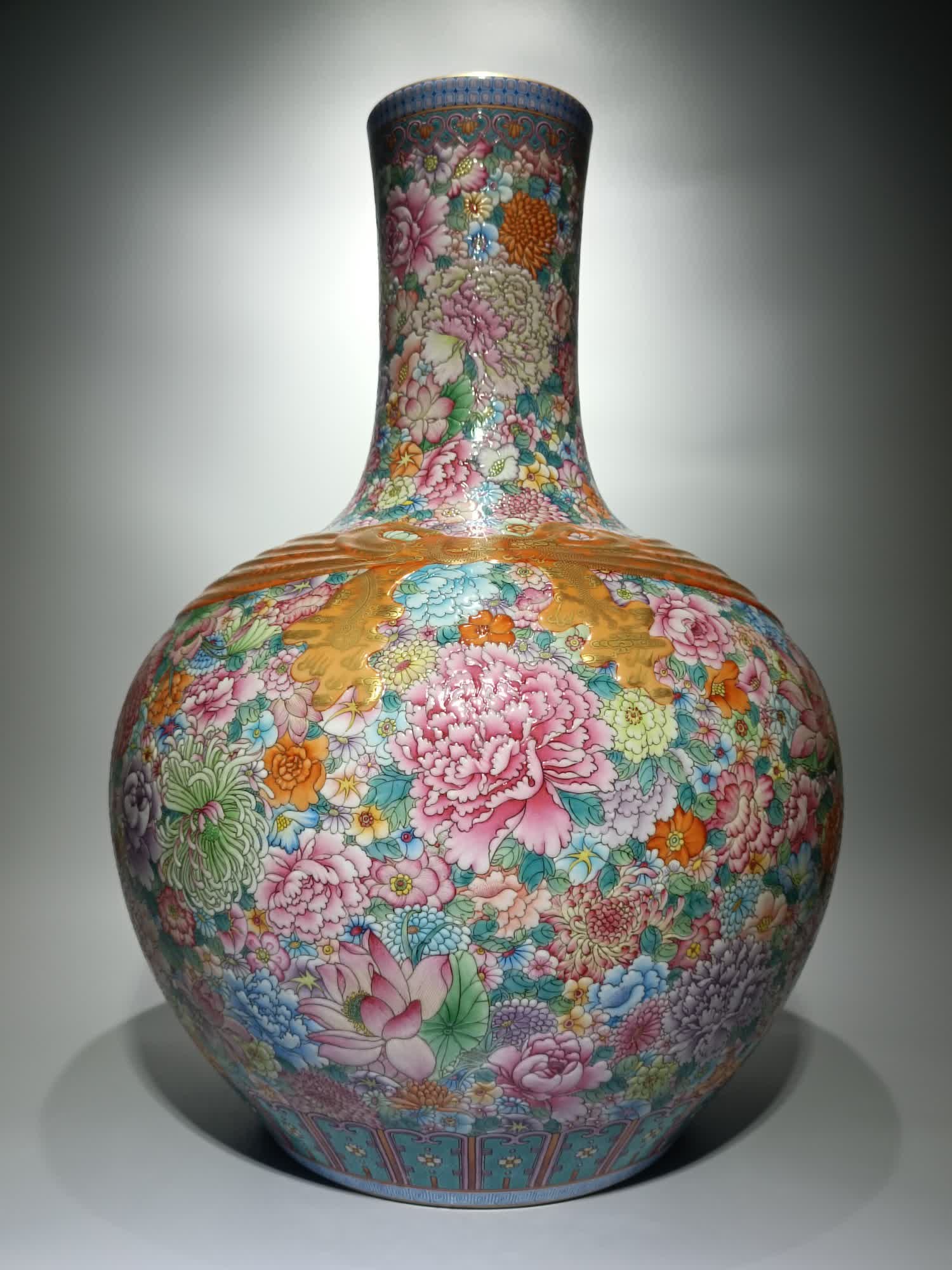 A Qing Qianlong model enamel colorful dragon and phoenix presents auspiciousness, and the flowers (1 of 9)