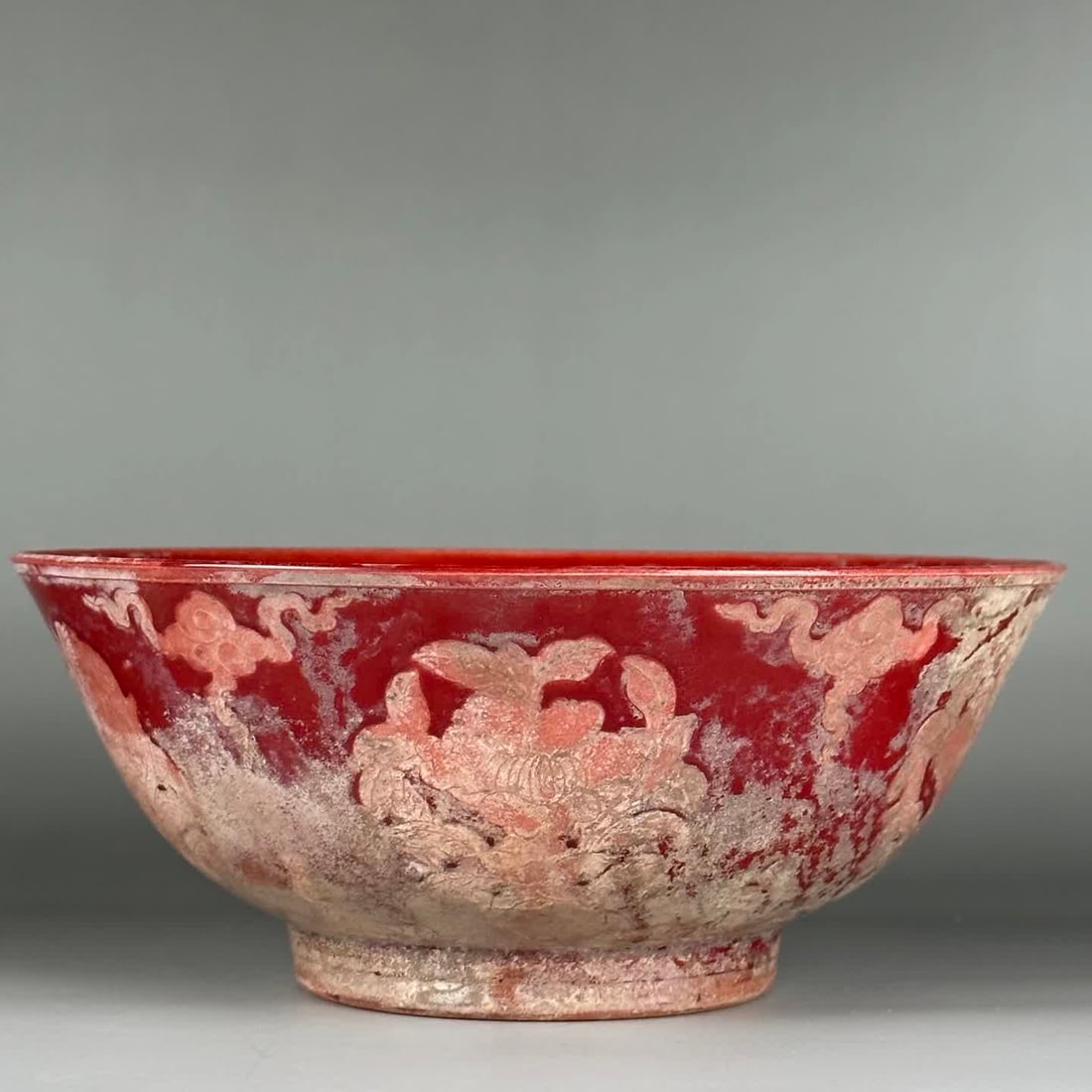 A Ming Dynasty Ming Chenghua red glaze carved peony flower pattern bowl (1 of 9)
