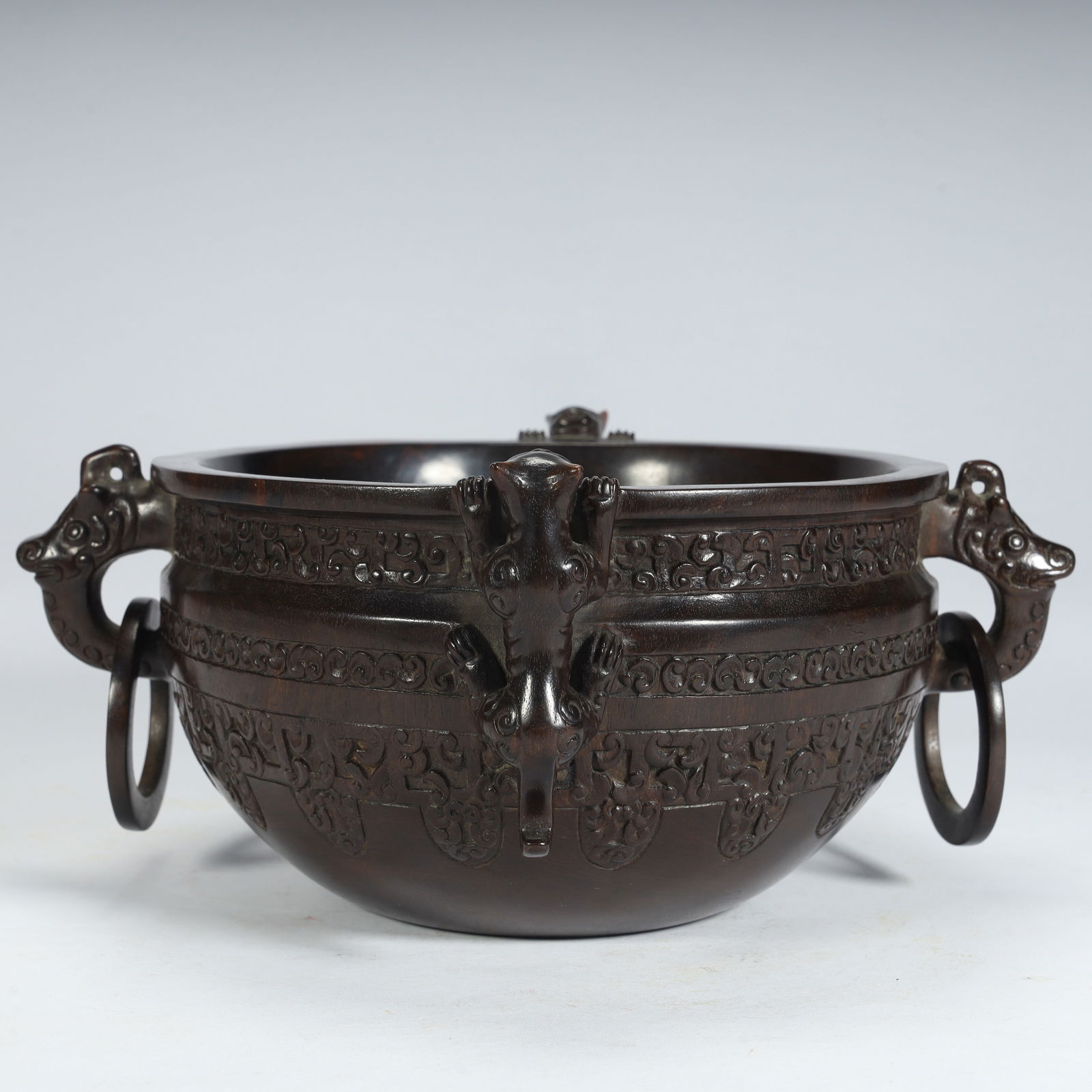 A Qing Dynasty rosewood carved dragon tiger ring pattern washing furnace (1 of 9)