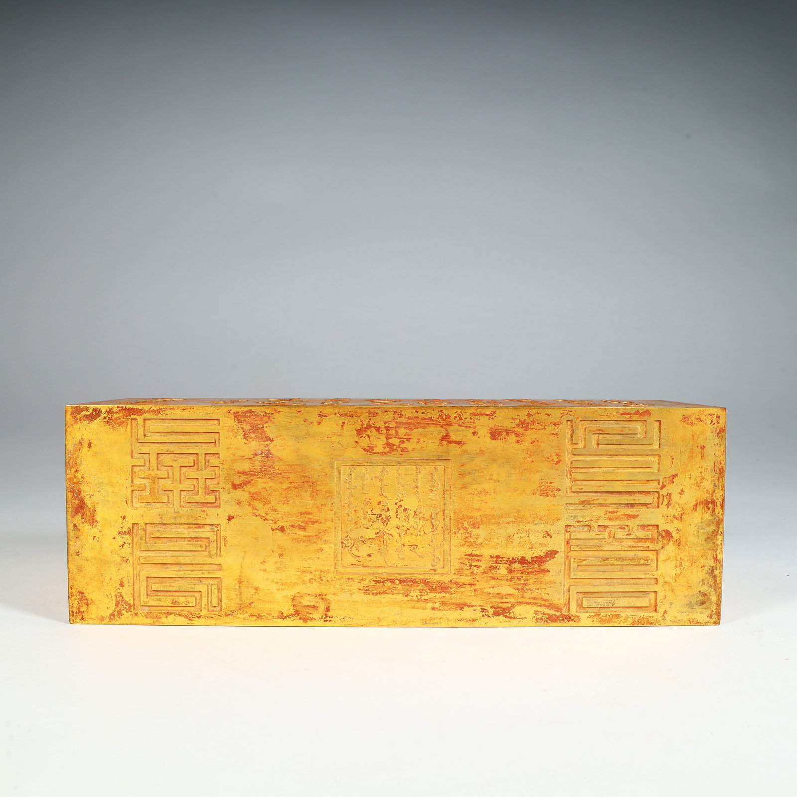 A silver-gilt block - 10