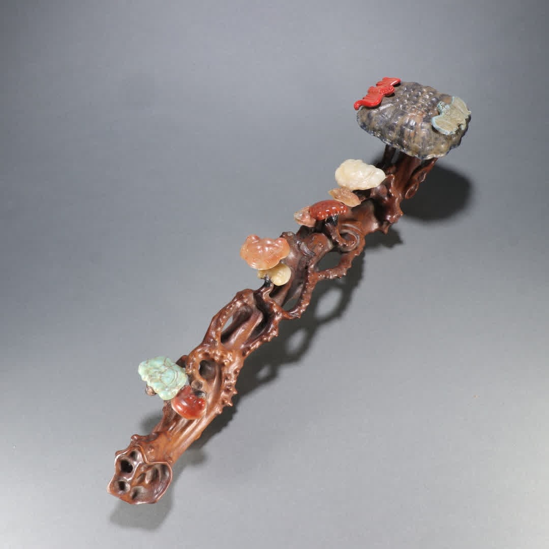 A Qing Dynasty Huanghuali inlaid with a hundred treasures ruyi handle (1 of 9)