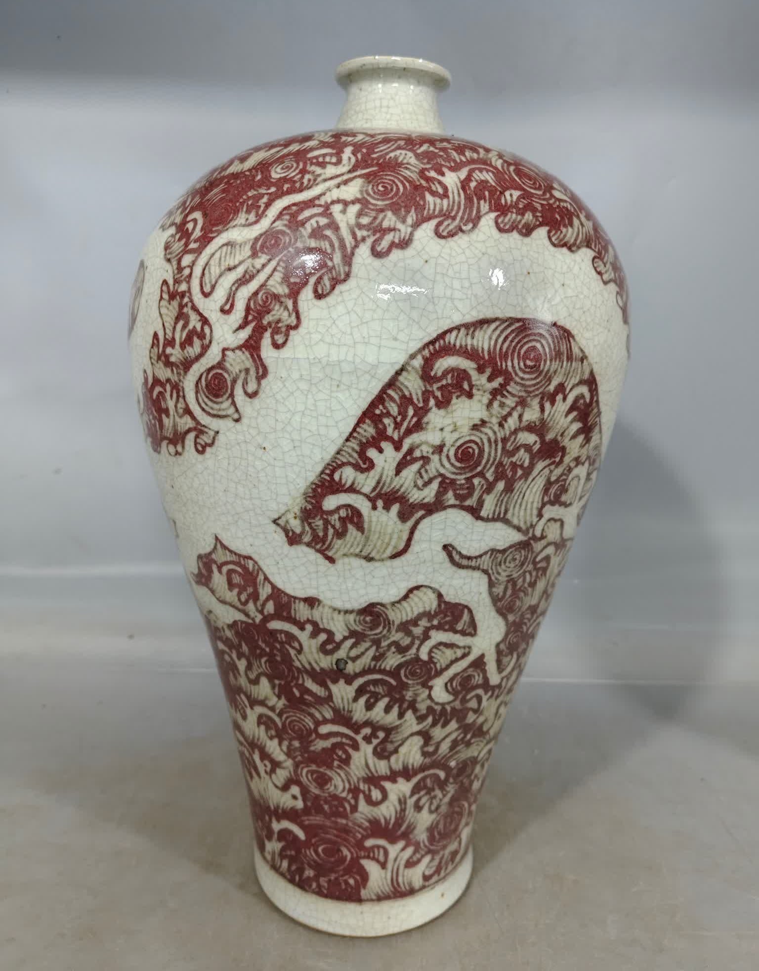 A Ming Dynasty Cizhou kiln glaze red white seawater dragon pattern plum bottle (1 of 7)