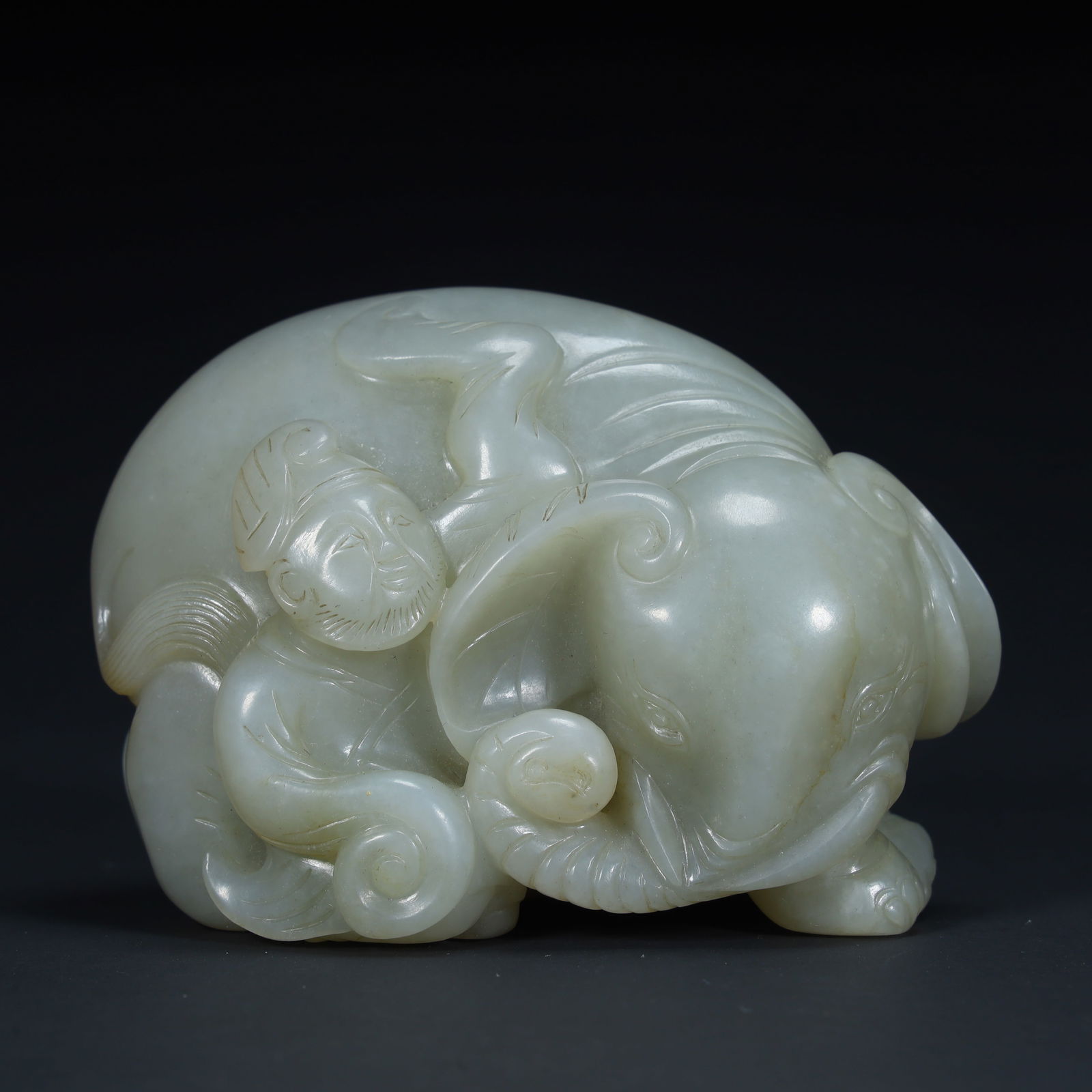 A Ming Dynasty green and white jade "boy washing elephant" ornament, (1 of 8)