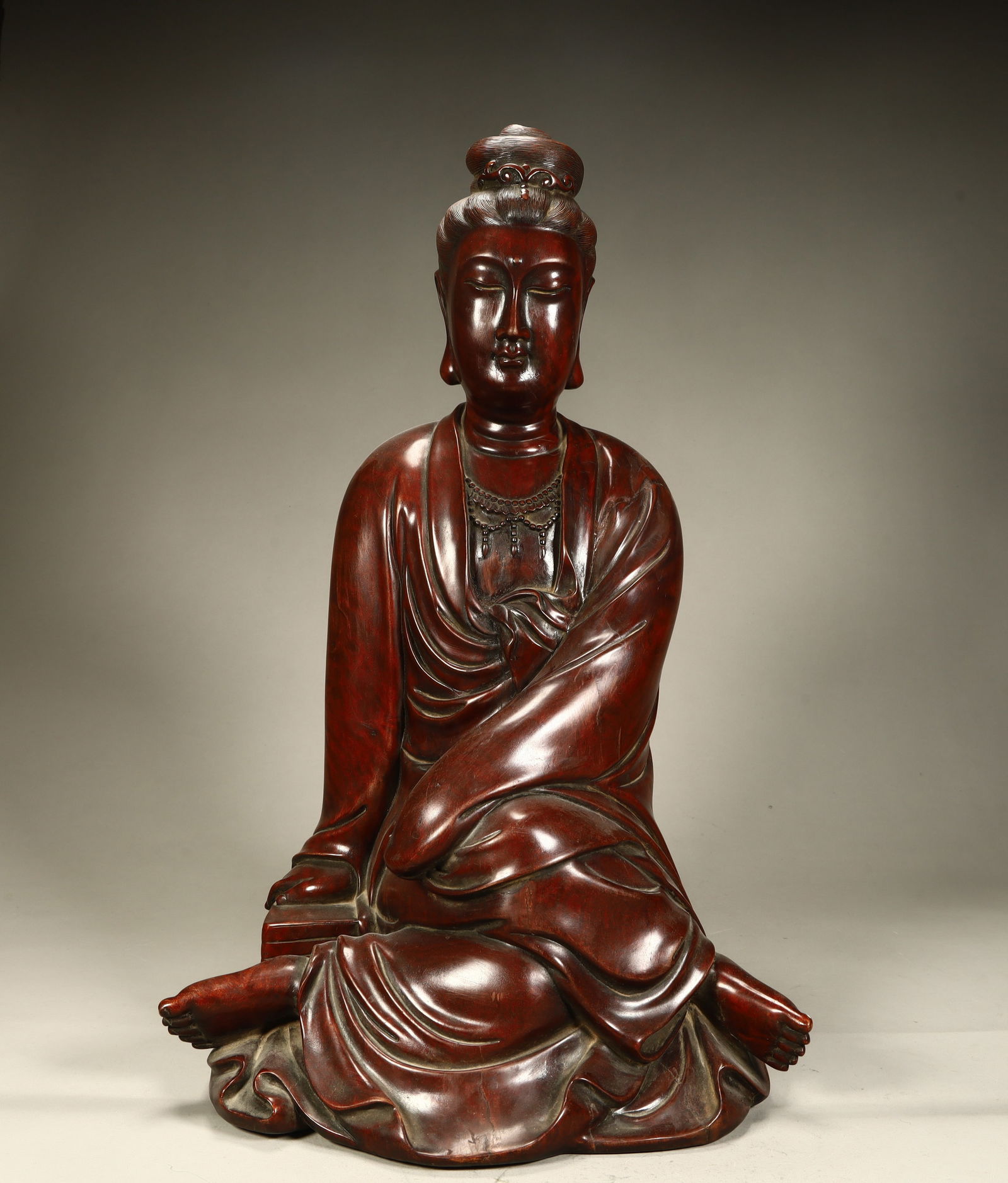 A seated statue of Guanyin carved in mahogany in the Qing Dynasty (1 of 9)