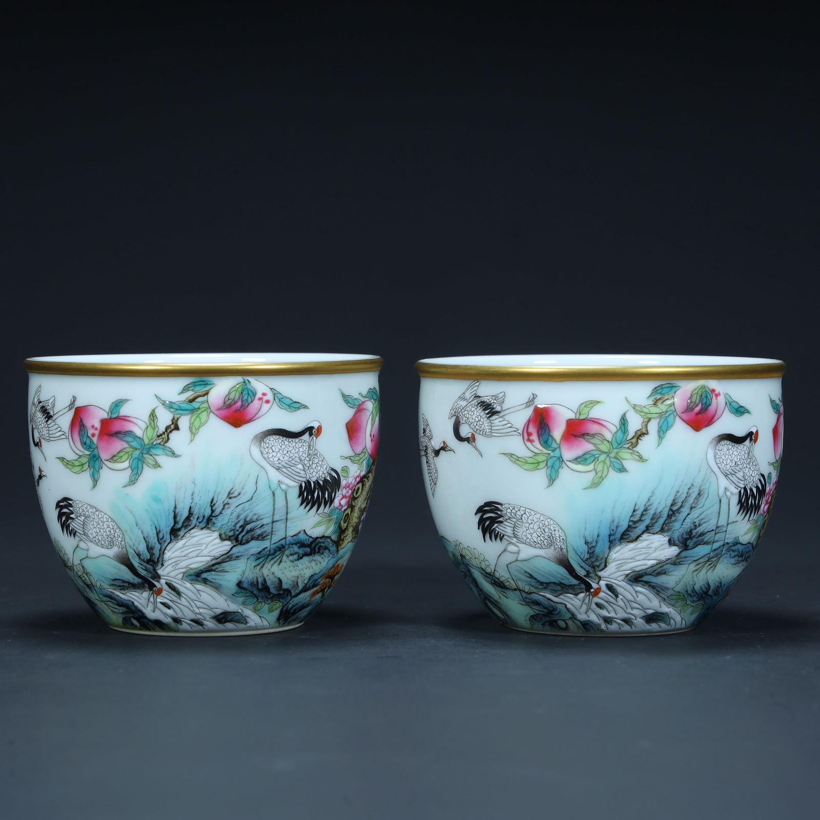 A pair of Qing Dynasty pastel "crane peach birthday" pattern cups: Qing Dynasty pastel "crane peach birthday" pattern cup SIZE: H:6cm L:7.8cm W:7.8cm W:228g (The Dimensions Of All Batches Are Manually Measured.If You Need More Detailed Information, Please Contact