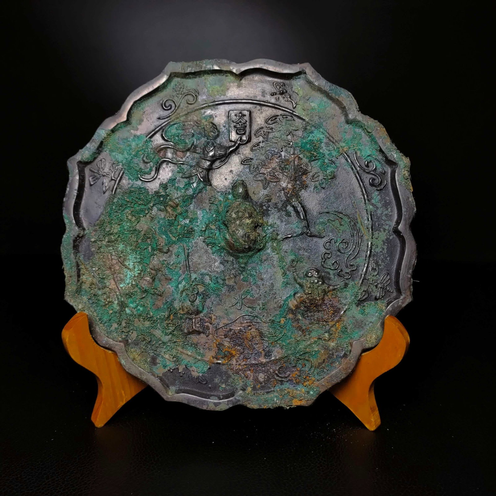 A bronze black lacquer ancient figure mirror (1 of 9)