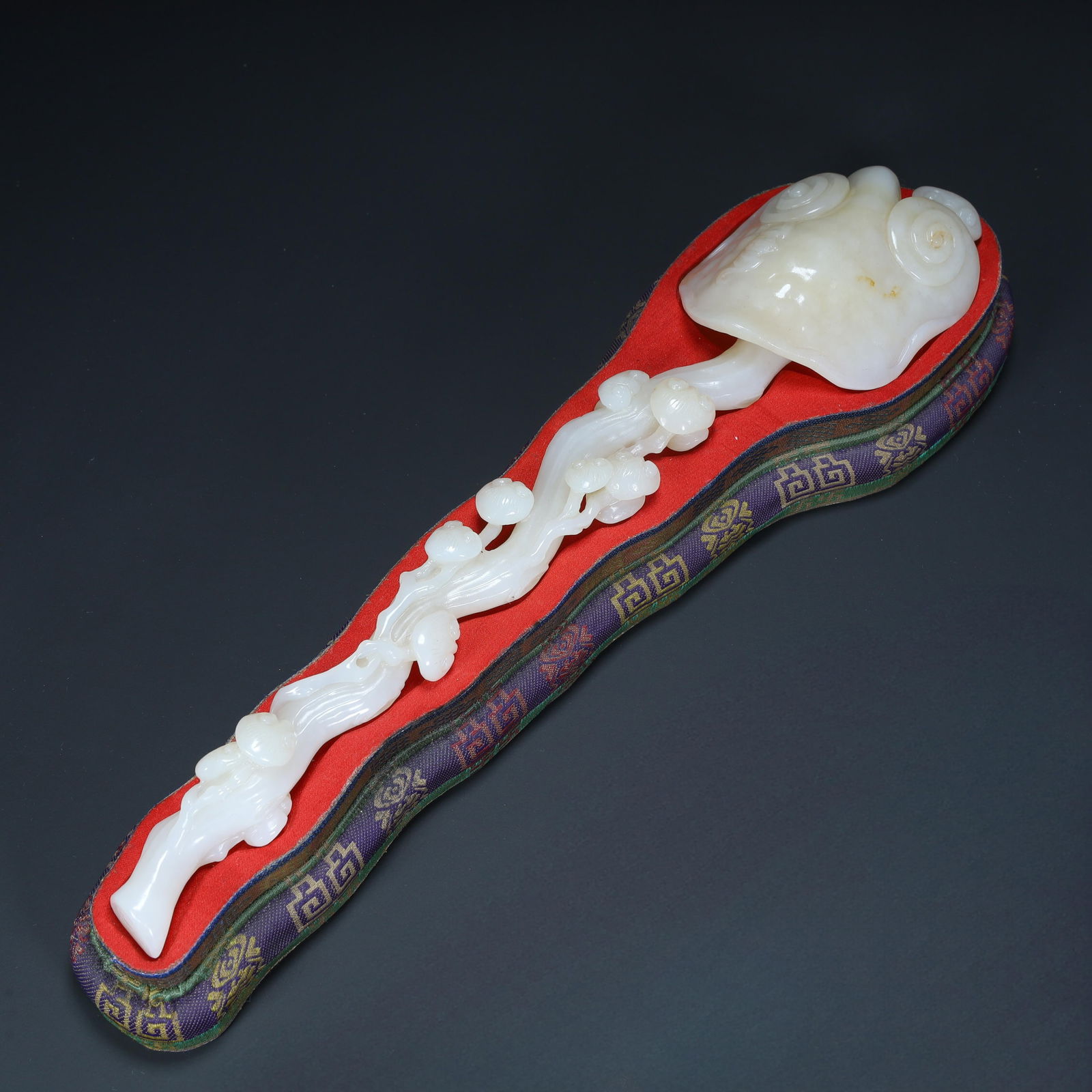 A Qing Dynasty Hetian jade "ruyi" ornament, (1 of 12)
