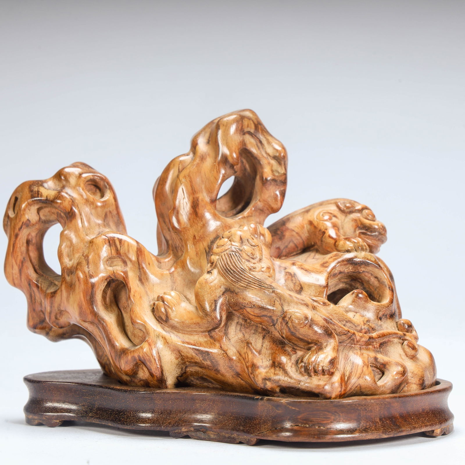 A Qing Dynasty Huanghuali wood carving Taihu Lake stone auspicious beast pattern mountain ornament: Qing Dynasty Huanghuali wood carving Taihu Lake stone auspicious beast pattern mountain ornament Size: H:9cm L: 12cm W:7.5cm W:186g (The Dimensions Of All Batches Are Manually Measured.If You Need Mor