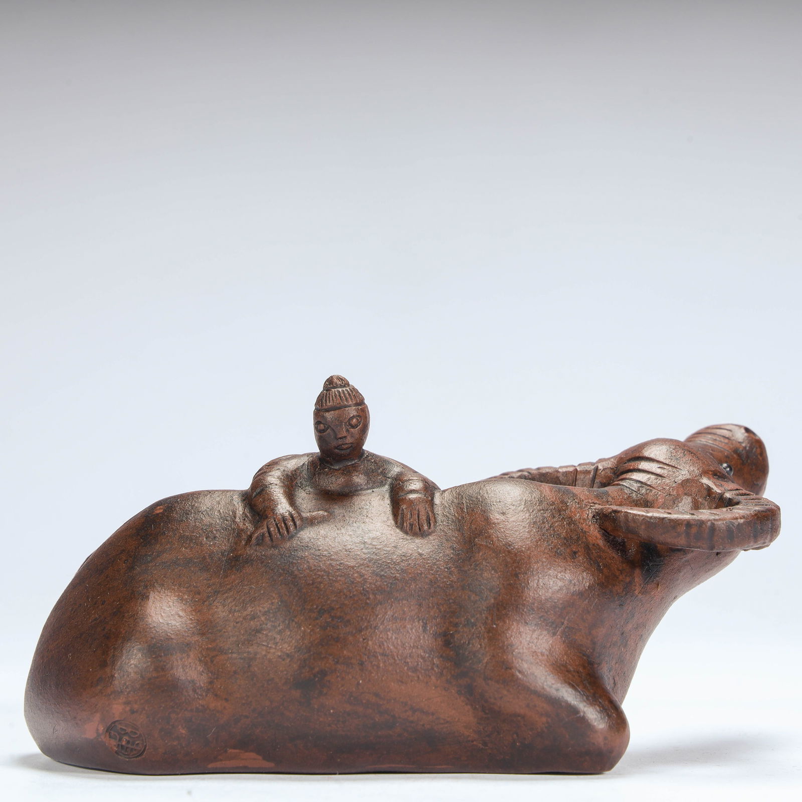 A purple sand shepherd boy riding a cow ornament from the Qing Dynasty (1 of 9)