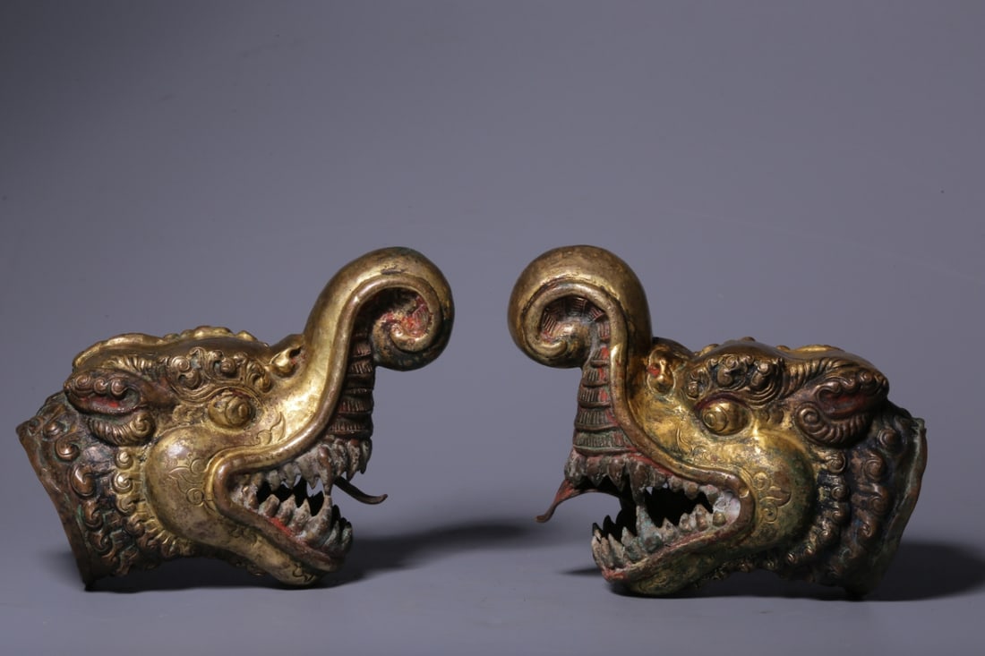 A pair of copper-gilt Capricorn beast heads from the Qing Dynasty: The copper-gilt Capricorn beast head of the Qing Dynasty Size:H:12cm L:8.5cm W:6cm W:318 (The Dimensions Of All Batches Are Manually Measured.If You Need More Detailed Information, Please Contact Our
