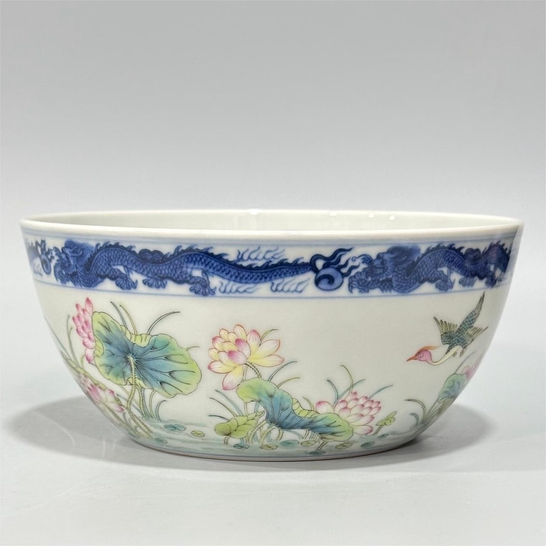 A pastel blue and white dragon-edged flower and bird pattern bowl made in the Qing Dynasty: Qing Dynasty Qing Dynasty Pastel blue and white dragon edge flower and bird pattern bowl Size:H:7cm Calibre:15.8cm (The Dimensions Of All Batches Are Manually Measured.If You Need