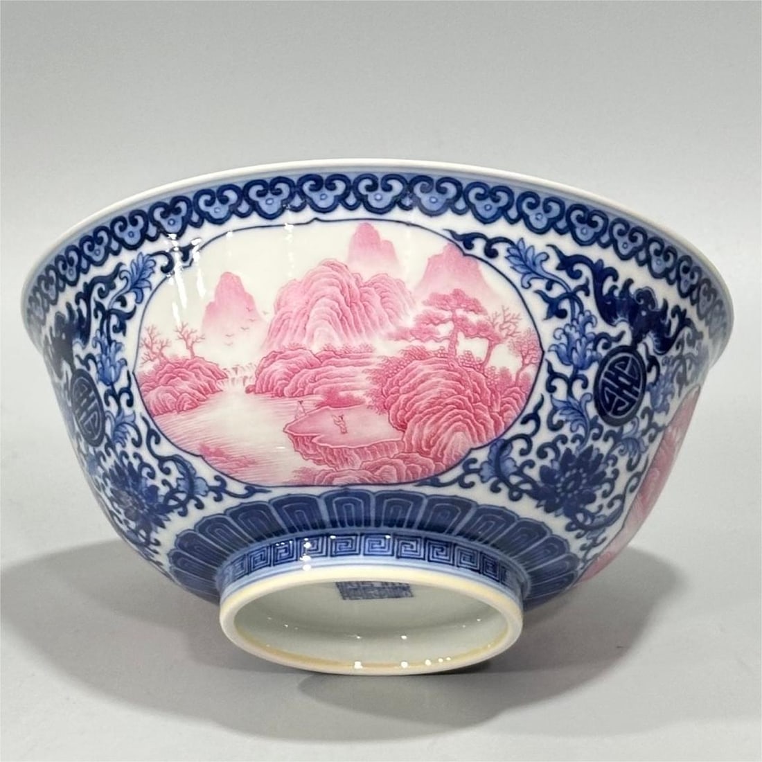 A Qing Dynasty enamel blue and white Fushou flower entwined window agate red landscape pavilion: Qing Dynasty Qianlong year system enamel blue and white Fushou flower entwined branches open window agate red landscape pavilion character bowl Size:H:8cm Calibre:17.5cm (The Dimensions Of All Batches