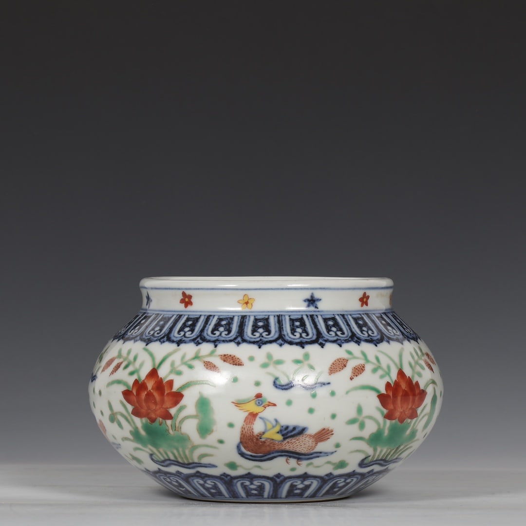 A blue and white colorful mandarin duck lotus pond pattern jar made in the Xuande year of the Ming (1 of 9)