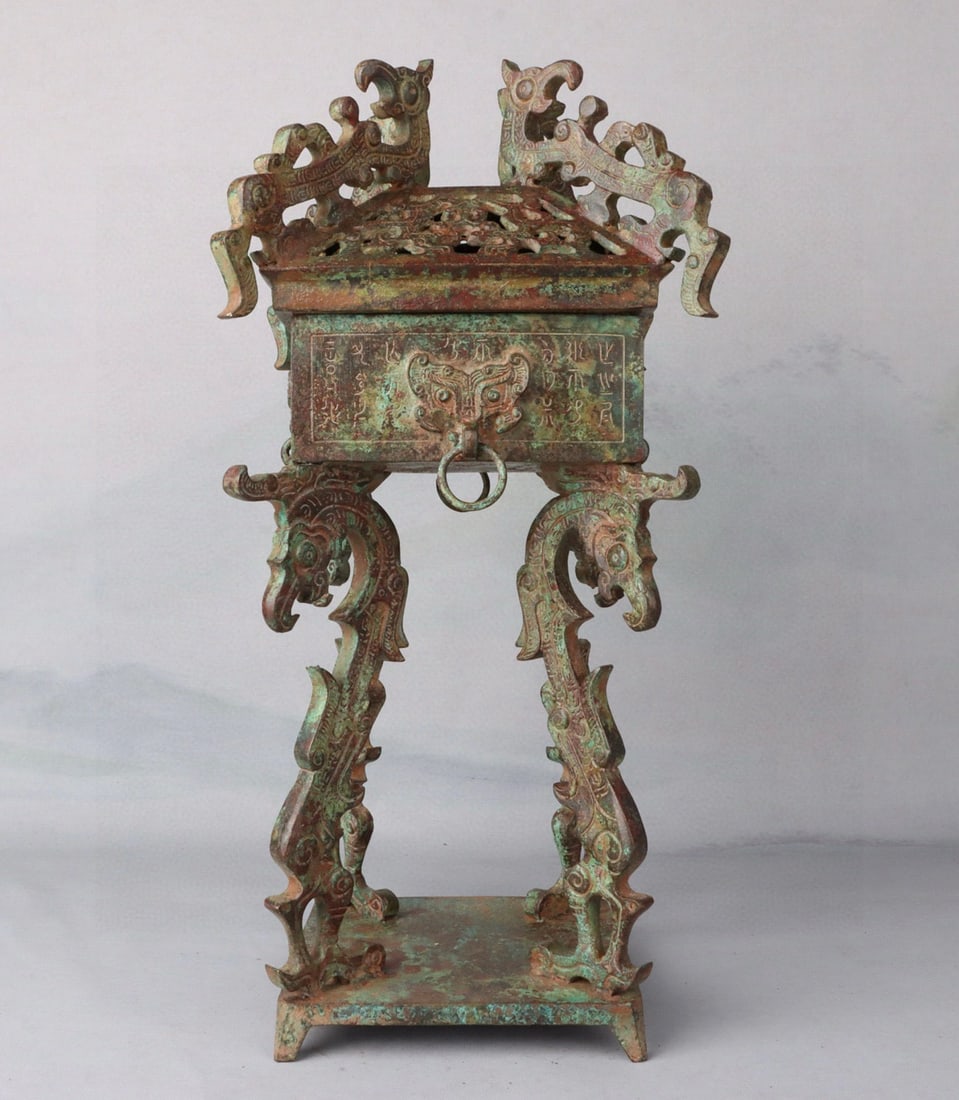 A bronze hollow square furnace from the Spring and Autumn Period: Bronze hollow square furnace in the Spring and Autumn Period W:4750g L:38cm W:17cm (The Dimensions Of All Batches Are Manually Measured.If You Need More Detailed Information, Please Contact Our Custom