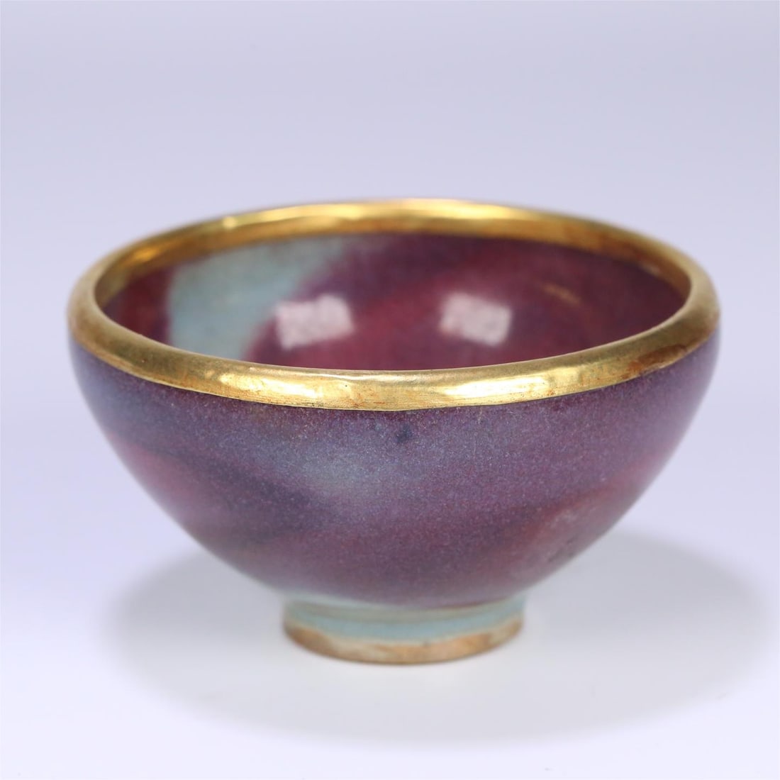 A silver-gilt gold-rimmed small tea bowl from the Song Dynasty Jun kiln: The silver-gilt gold-rimmed small tea bowl of the Song Dynasty Jun kiln Size:9.1x5.2cm (The Dimensions Of All Batches Are Manually Measured.If You Need More Detailed Information, Please Contact Our Cu