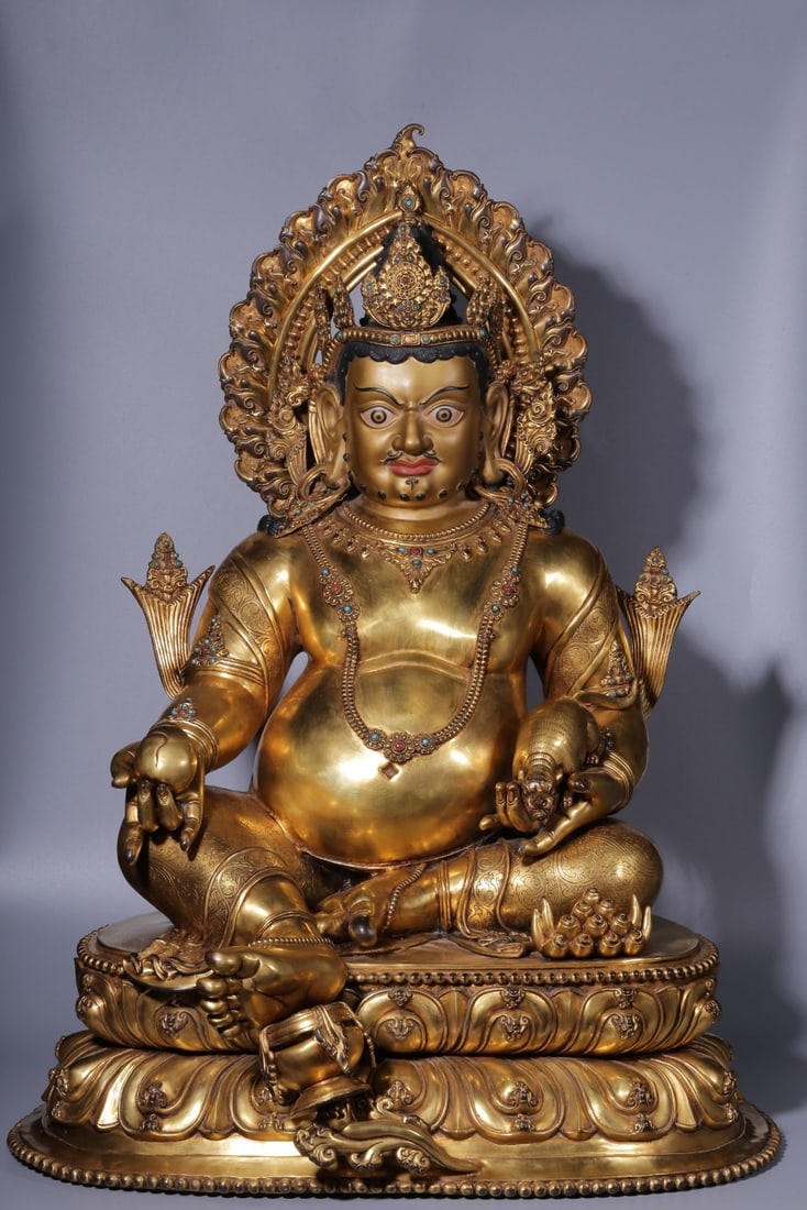 A seated statue of the God of Wealth in the Qing Dynasty with copper gilt inlaid treasures: The copper gilt inlaid treasure yellow God of Wealth seated statue of the Qing Dynasty Size:H:73cm L:56cm W:44cm W:30.8kg (The Dimensions Of All Batches Are Manually Measured.If You Need More Detailed