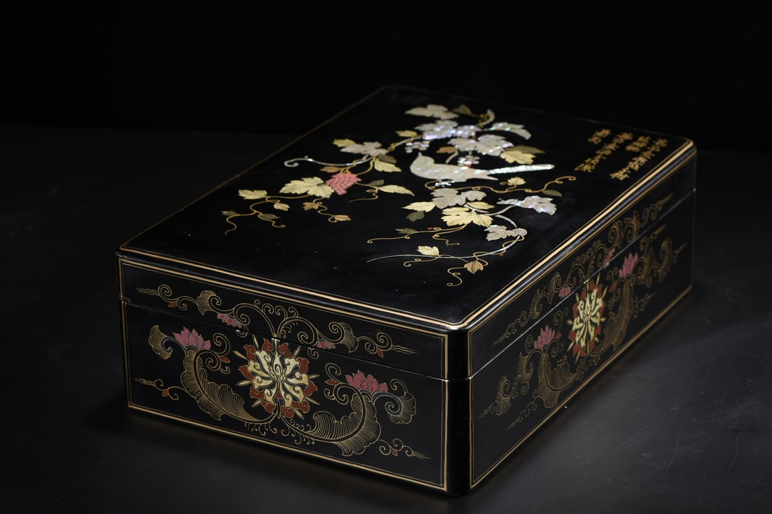 An Exquisite Black Lacquer Painted Gold Flower and Bird Pattern with poem Box: An Exquisite Black Lacquer Painted Gold Flower and Bird Pattern with poem Box Qing Dynasty, China Qianlong Four-character Mark Size:33cmx24cmx11cm Weight:830g (The Dimensions Of All Batches Are Manual