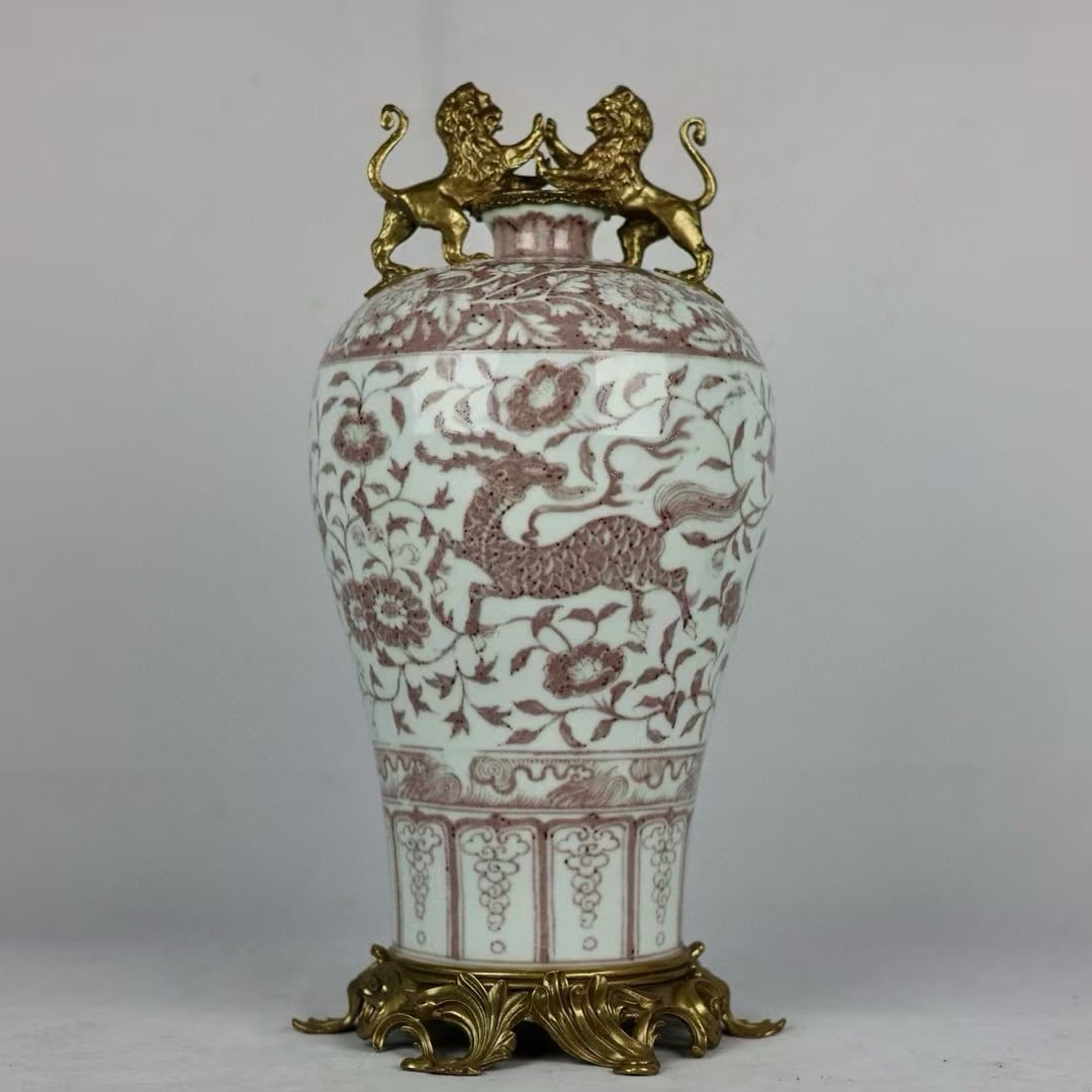 An Exquisite Underglaze-Red Inlaid Bronze Lotus Pattern Dragon and Phoenix Pattern Double-Ears Vase: An Exquisite Underglaze-Red Inlaid Bronze Lotus Pattern Dragon and Phoenix Pattern Double-Ears Vase Qing Dynasty, China Size:48cmx21cm (The Dimensions Of All Batches Are Manually Measured.If You Need