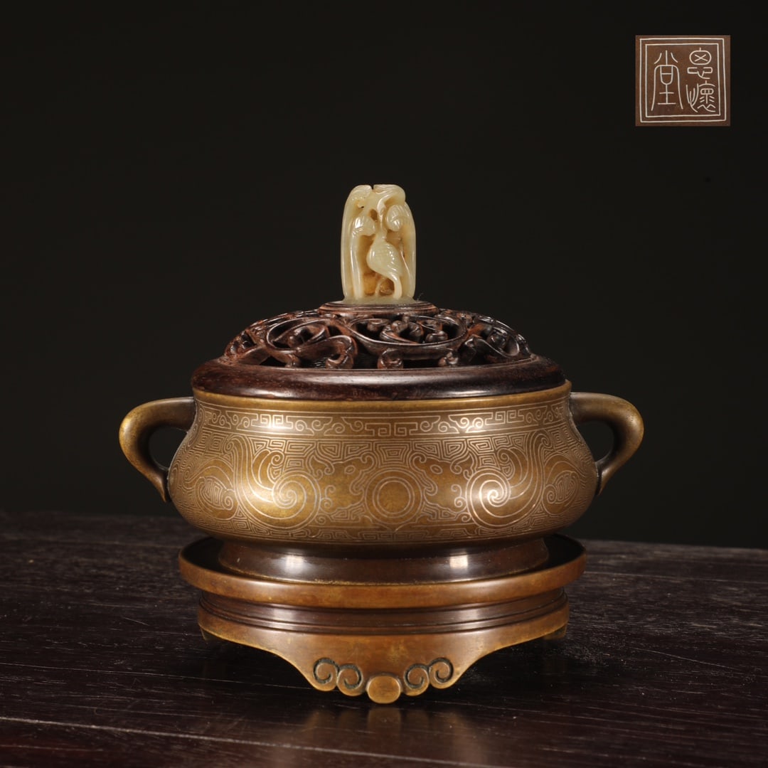 An Exquisite Bronze Inlaid Silver Phoenix Pattern Double-Ears and Tripod Censer: An Exquisite Bronze Inlaid Silver Phoenix Pattern Double-Ears and Tripod Censer Ming Dynasty, China Size:11.7cmx10.8cm Weight:1000g (The Dimensions Of All Batches Are Manually Measured.If You Need Mor