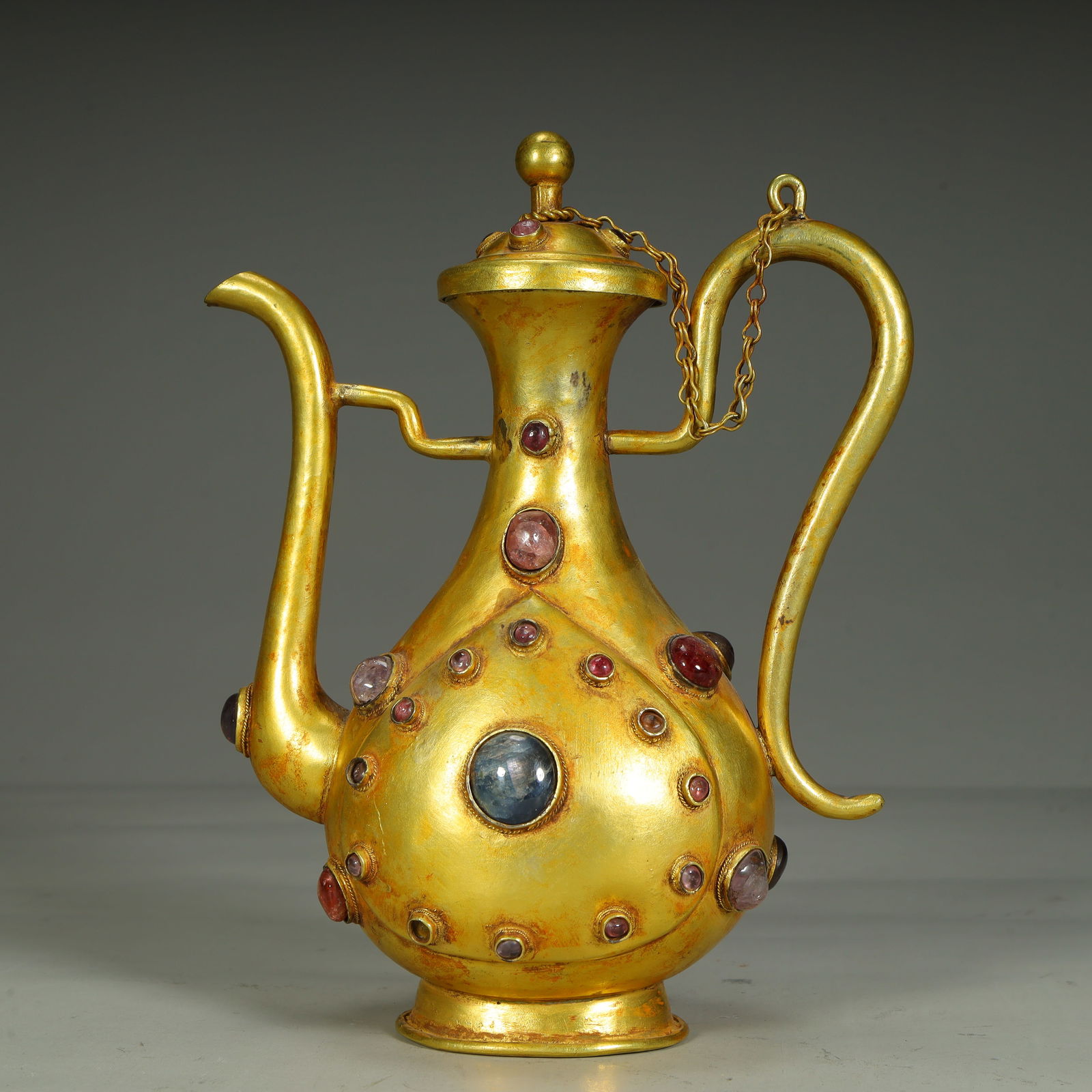 A Qing Dynasty silver-gilt gem-inlaid pot (1 of 10)
