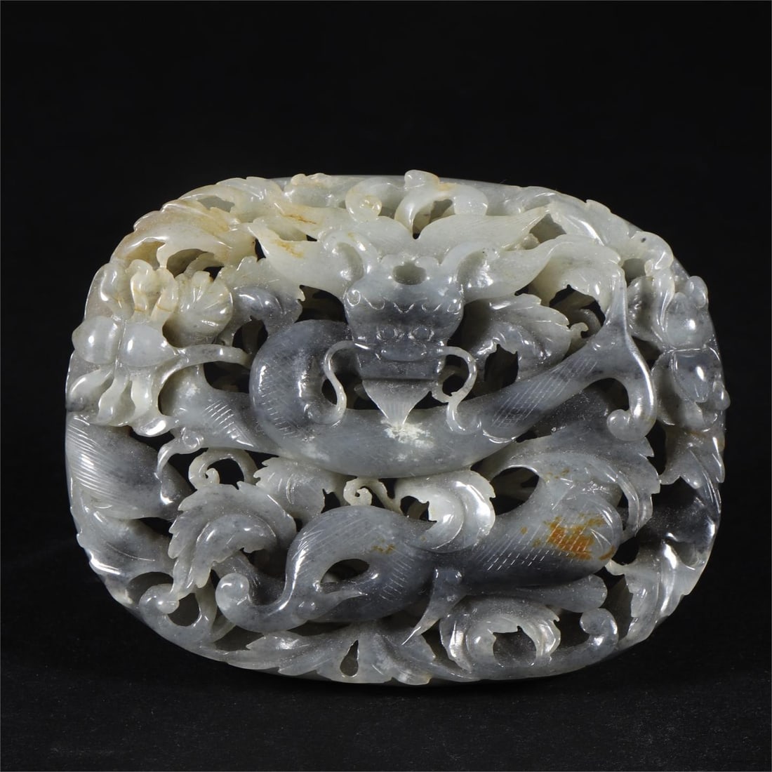 A Qing Dynasty blue and white Hetian jade seed material worn with flower dragon tiles (1 of 9)