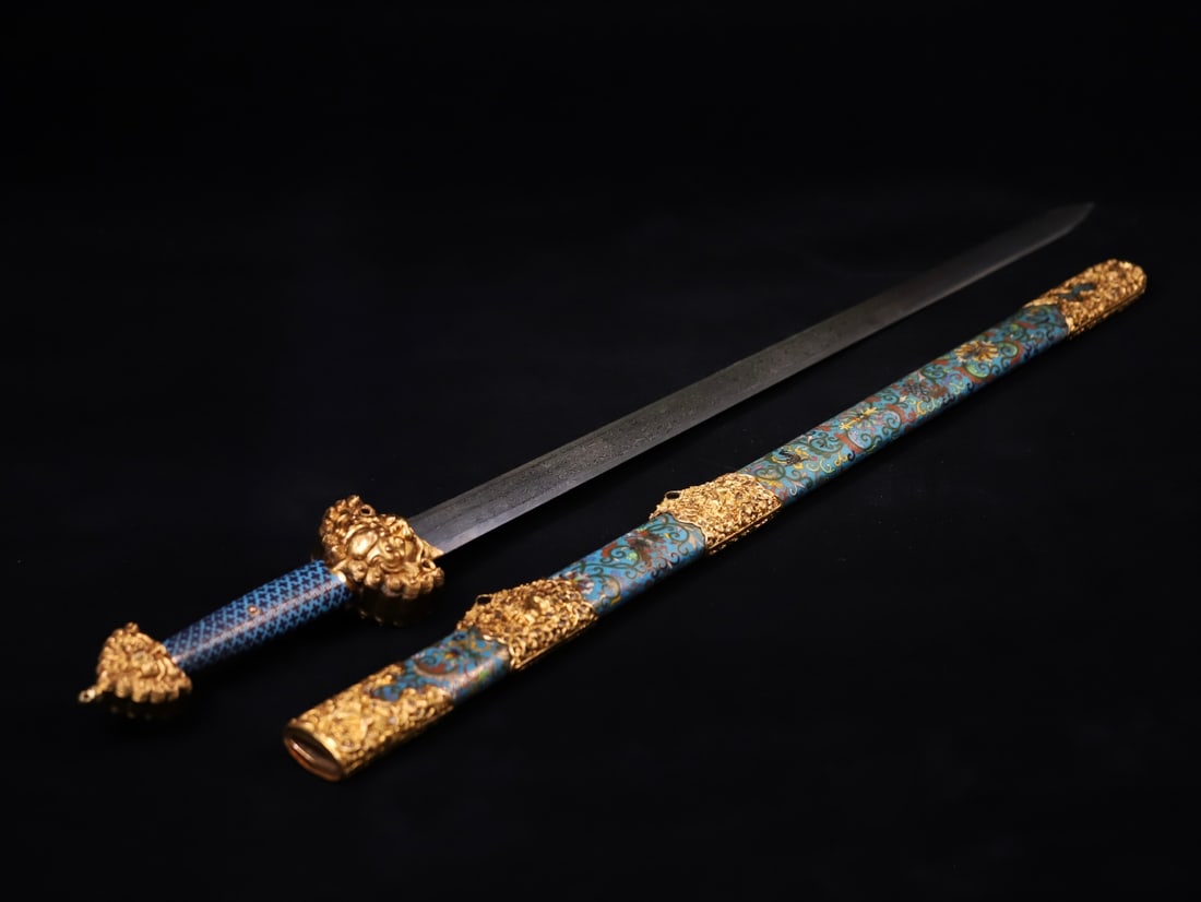 A copper-gilt enamel sword made in the Qianlong period of the Qing Dynasty: Qing Dynasty Qianlong year copper gilt enamel color sword Size:L:108cm (The Dimensions Of All Batches Are Manually Measured.If You Need More Detailed Information, Please Contact Our Customer Service B