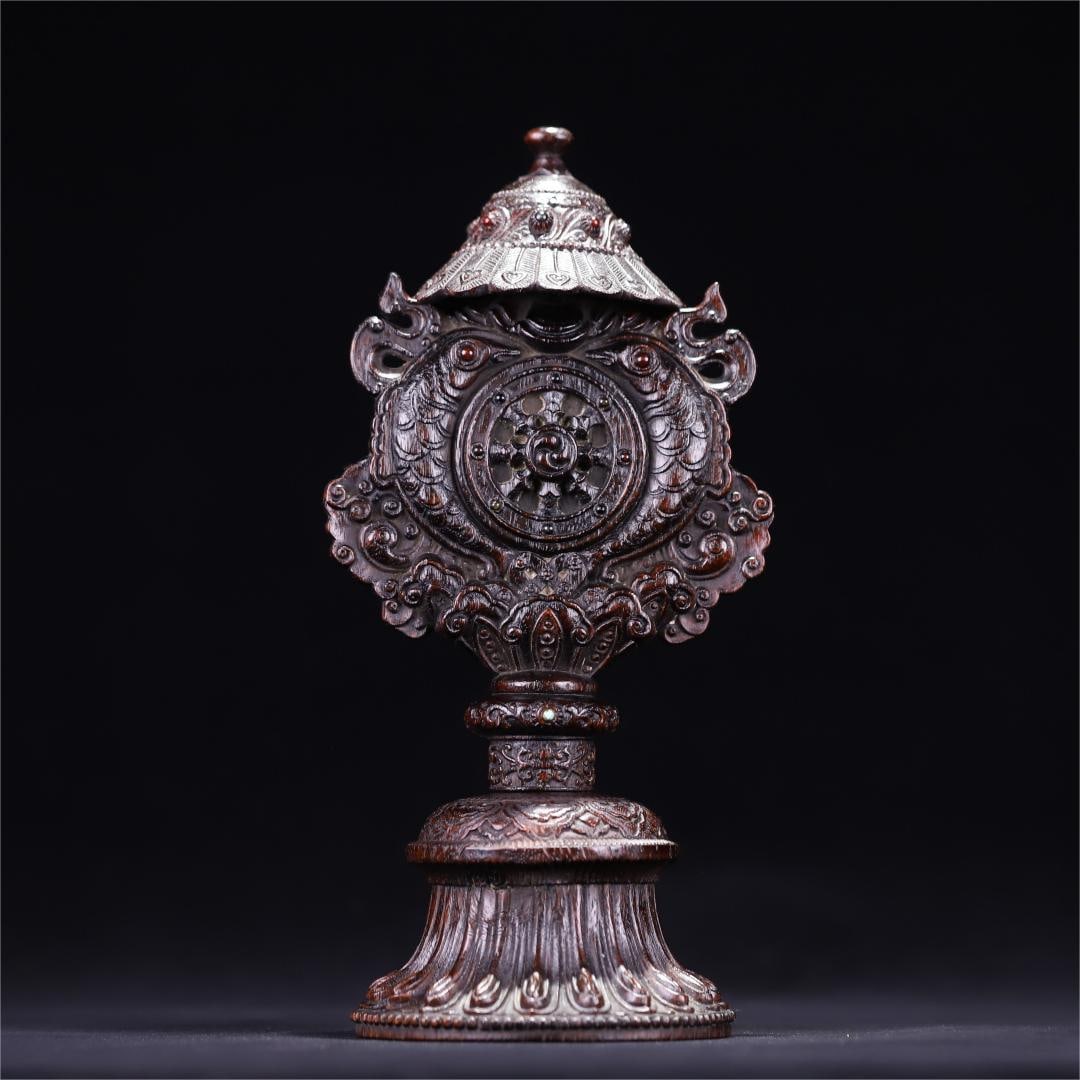A Qing Dynasty agarwood carved Dharma wheel treasure umbrella pattern offeror (1 of 10)