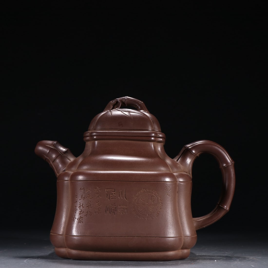 A purple sand bamboo pattern teapot with a golden tripod trademark (1 of 9)