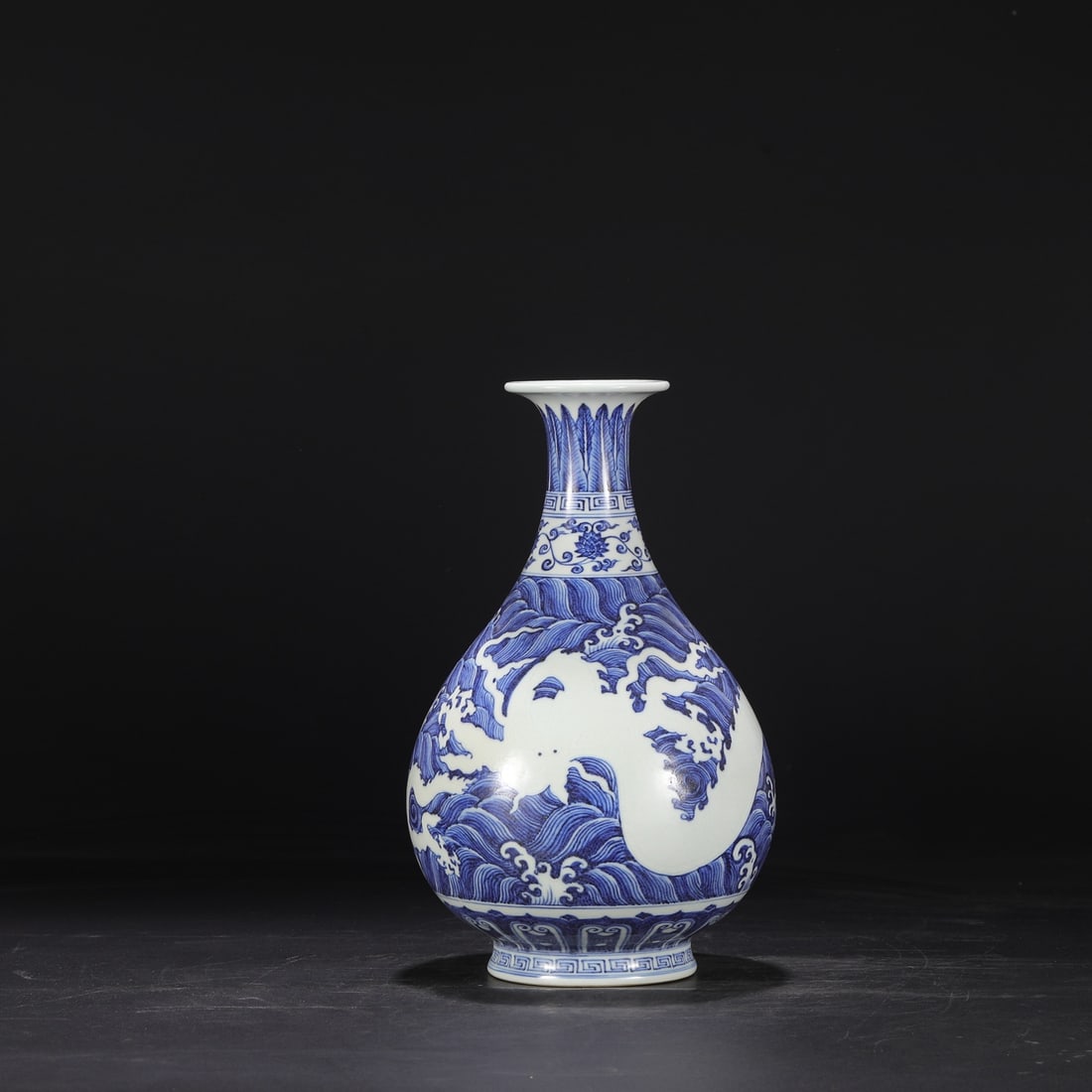 A blue and white blank carved seawater dragon pattern large jade pot spring vase made in the Xuande: The blue and white blank left blank in the Ming Dynasty and carved a large jade pot spring vase with a seawater dragon pattern Size:H:32cmCalibre:8.5cmBellydiameter:18cm (The