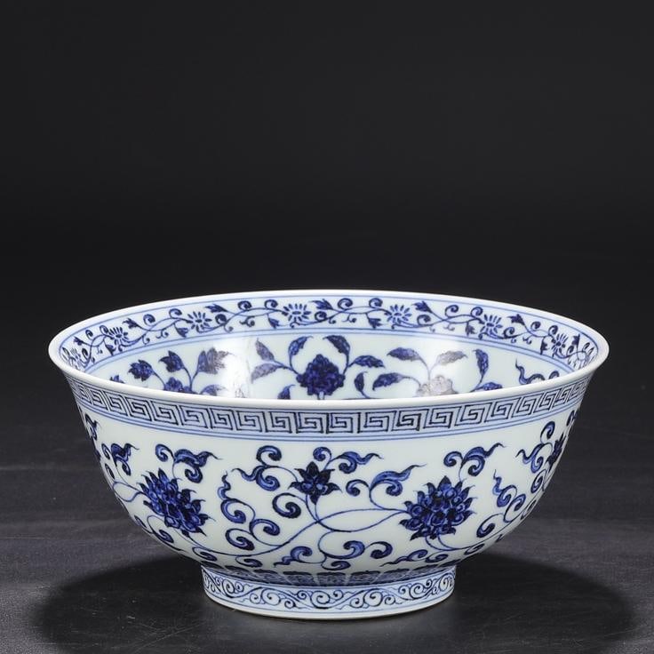A large bowl with a deep belly with a blue and white entwined floral pattern made in the Xuande (1 of 9)