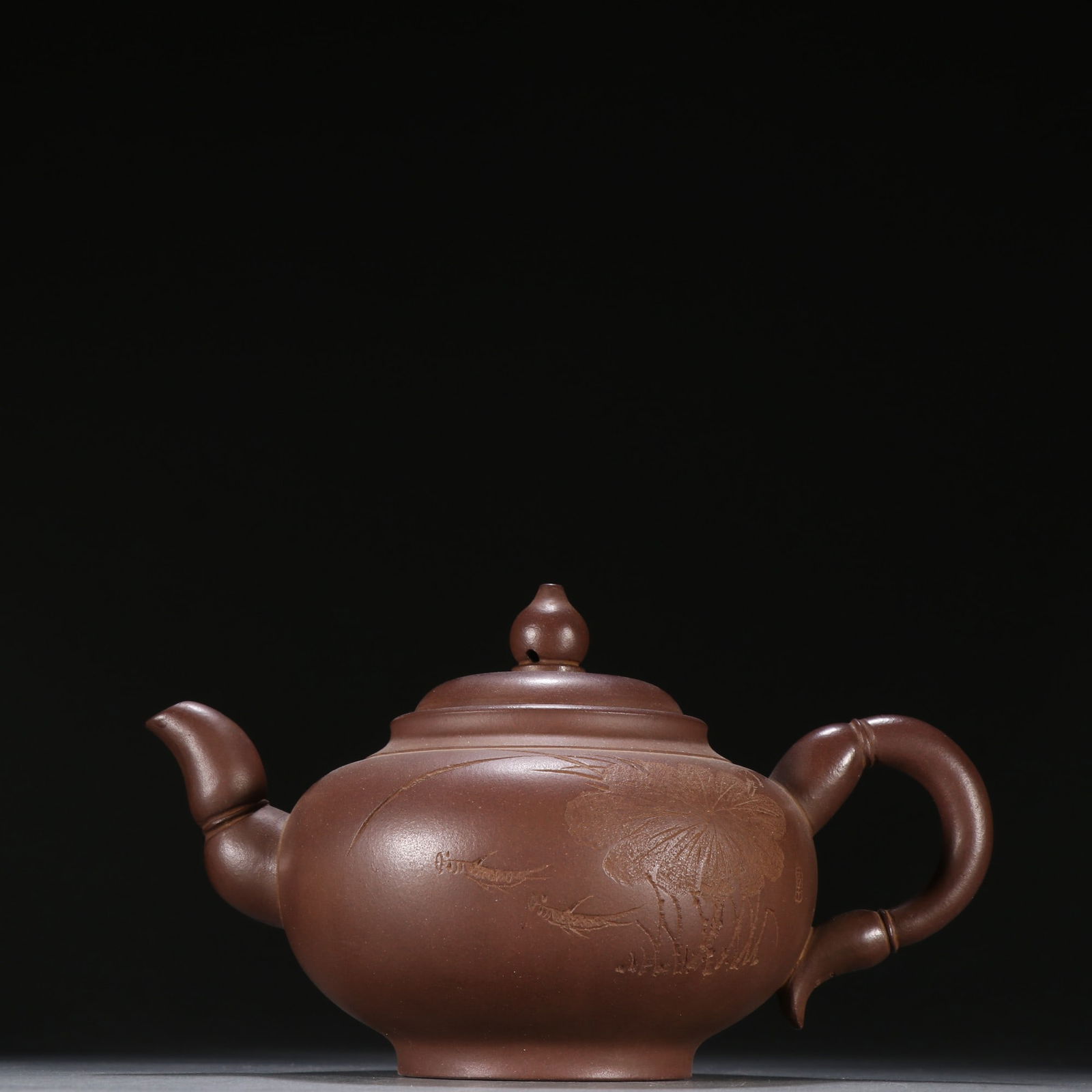A purple sand carved lotus leaf pattern teapot by Xu Hantang (1 of 9)