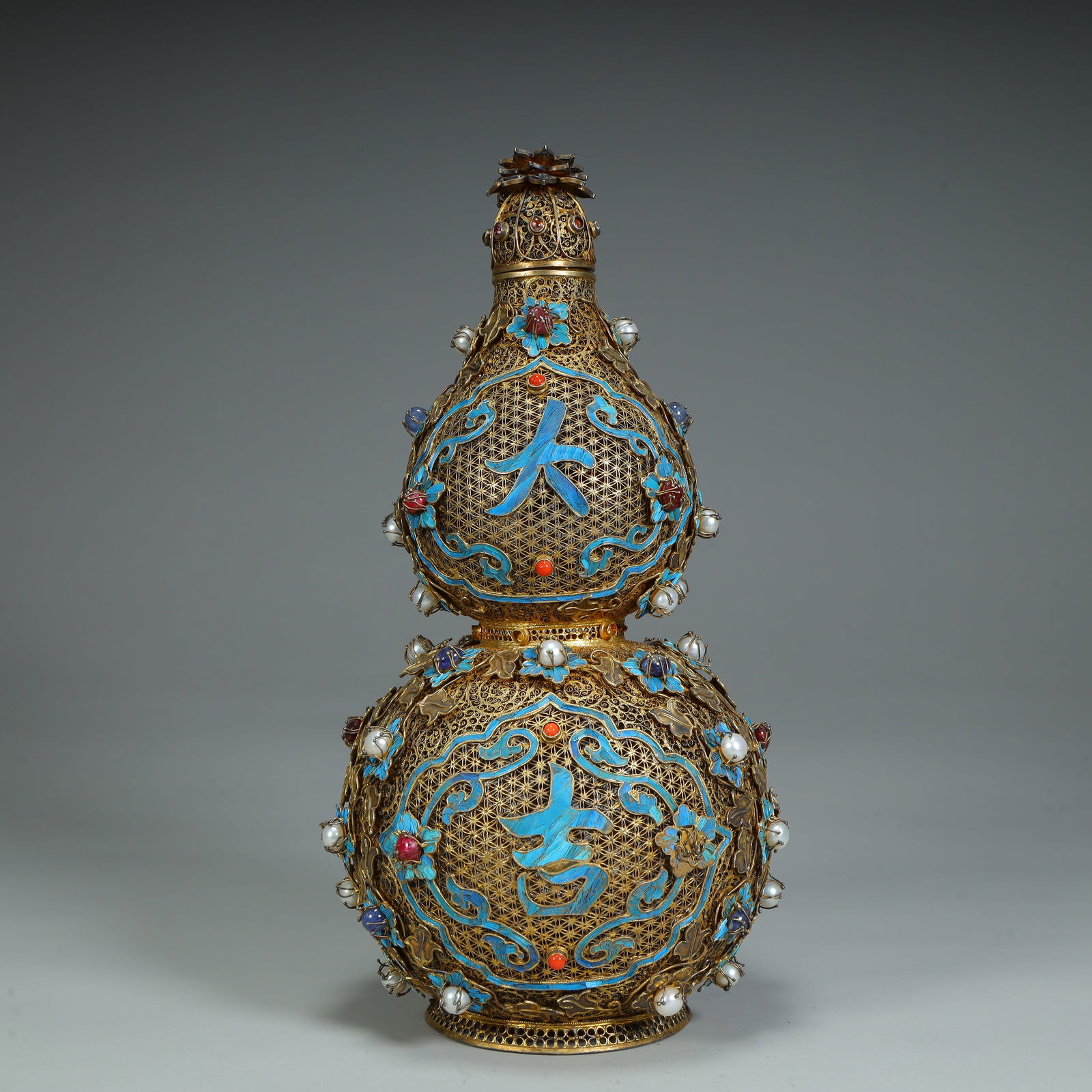 A Qing Dynasty silver-gilt silk gourd bottle (1 of 9)