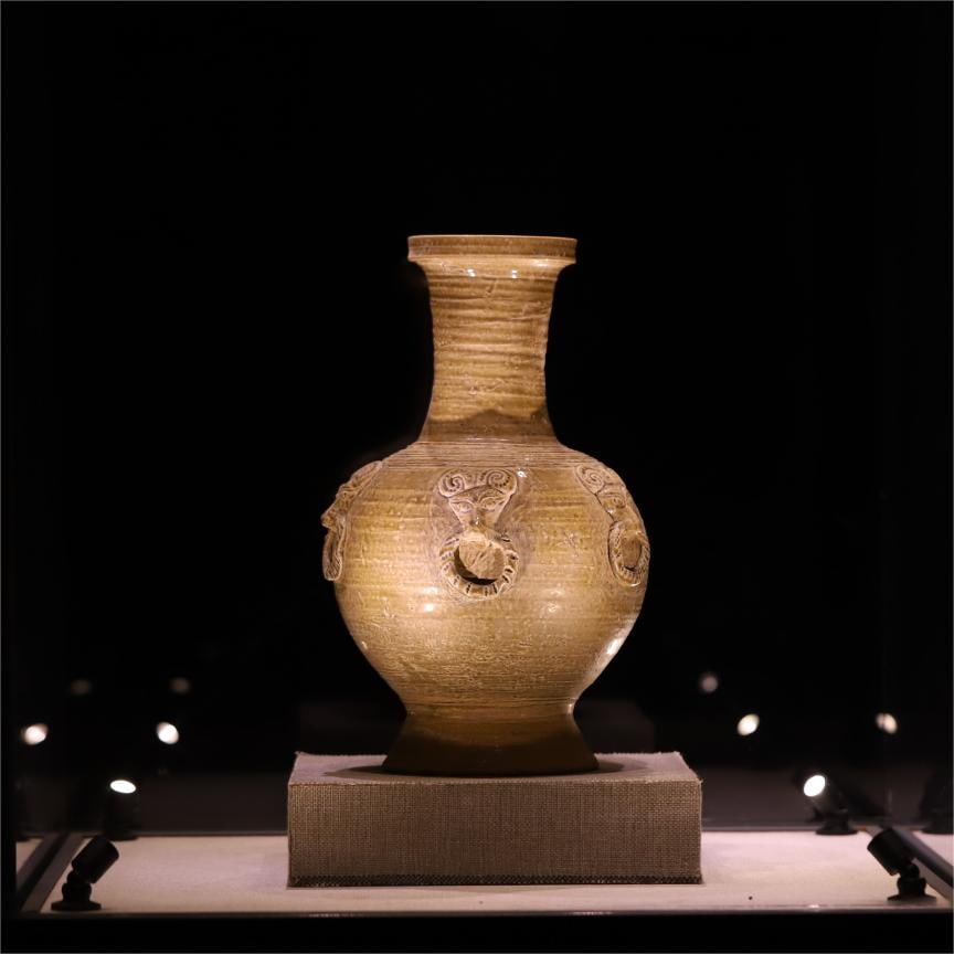 A Song Dynasty celadon paste paving head pattern pan mouth bottle: Song Dynasty celadon paste shop head pattern pankou bottle Size:34x21cm (The Dimensions Of All Batches Are Manually Measured.If You Need More Detailed Information, Please Contact Our Customer Service