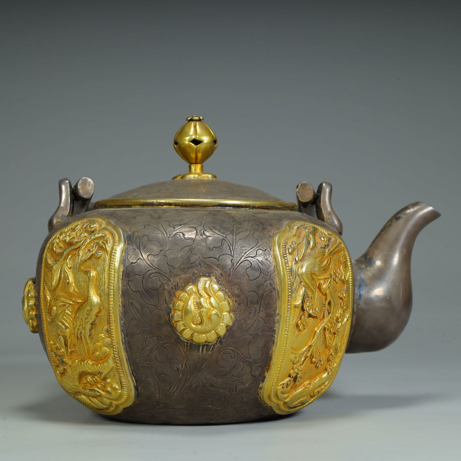 A Qing Dynasty silver-gilt flower and bird pattern teapot (1 of 11)